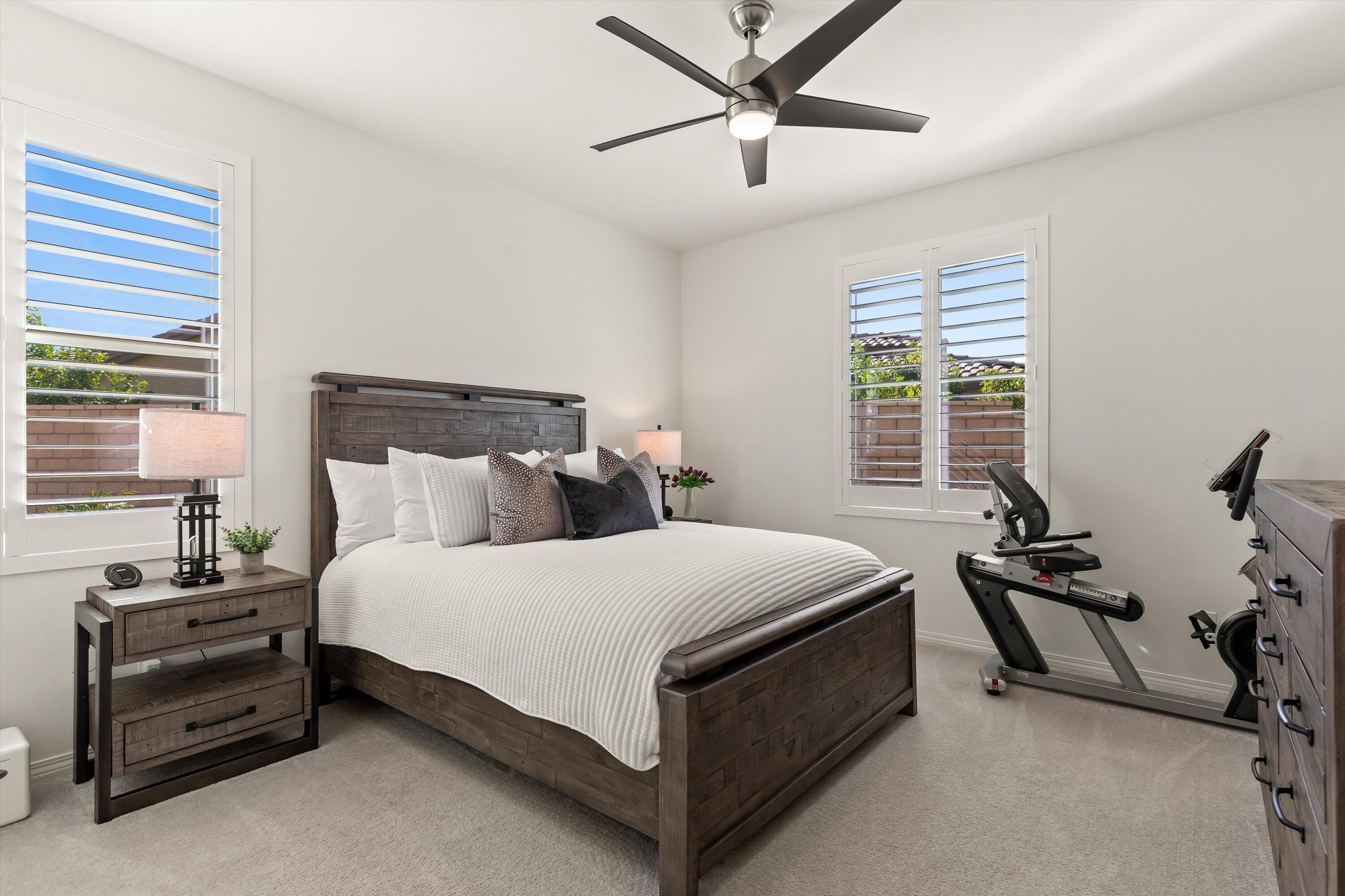 42940 Ascona Lane Indio, CA 92203 - Photo 14 of 36 a bed room with a bed and a window