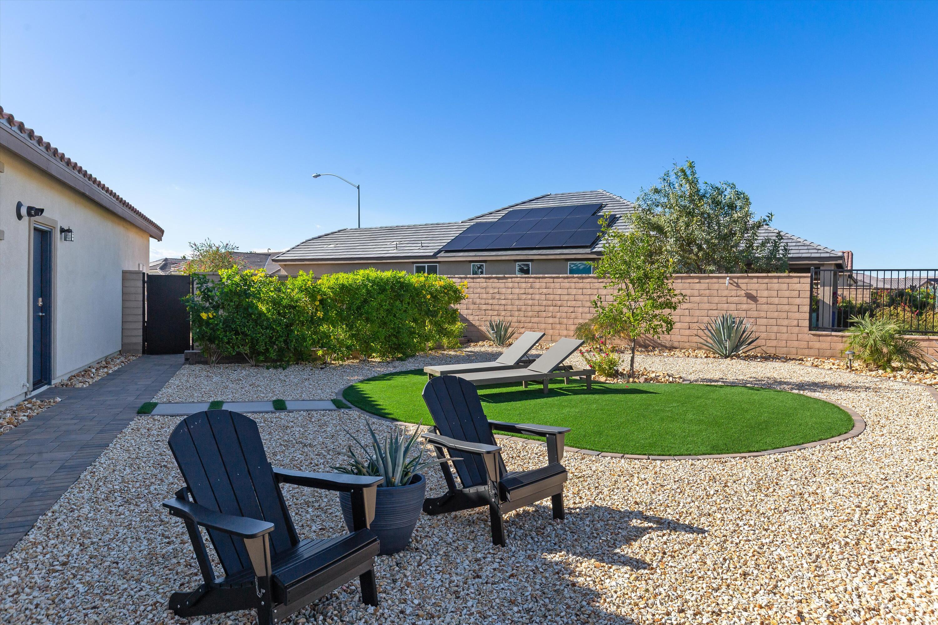 42940 Ascona Lane Indio, CA 92203 - Photo 23 of 36 a view of a table and chairs in backyard of the house