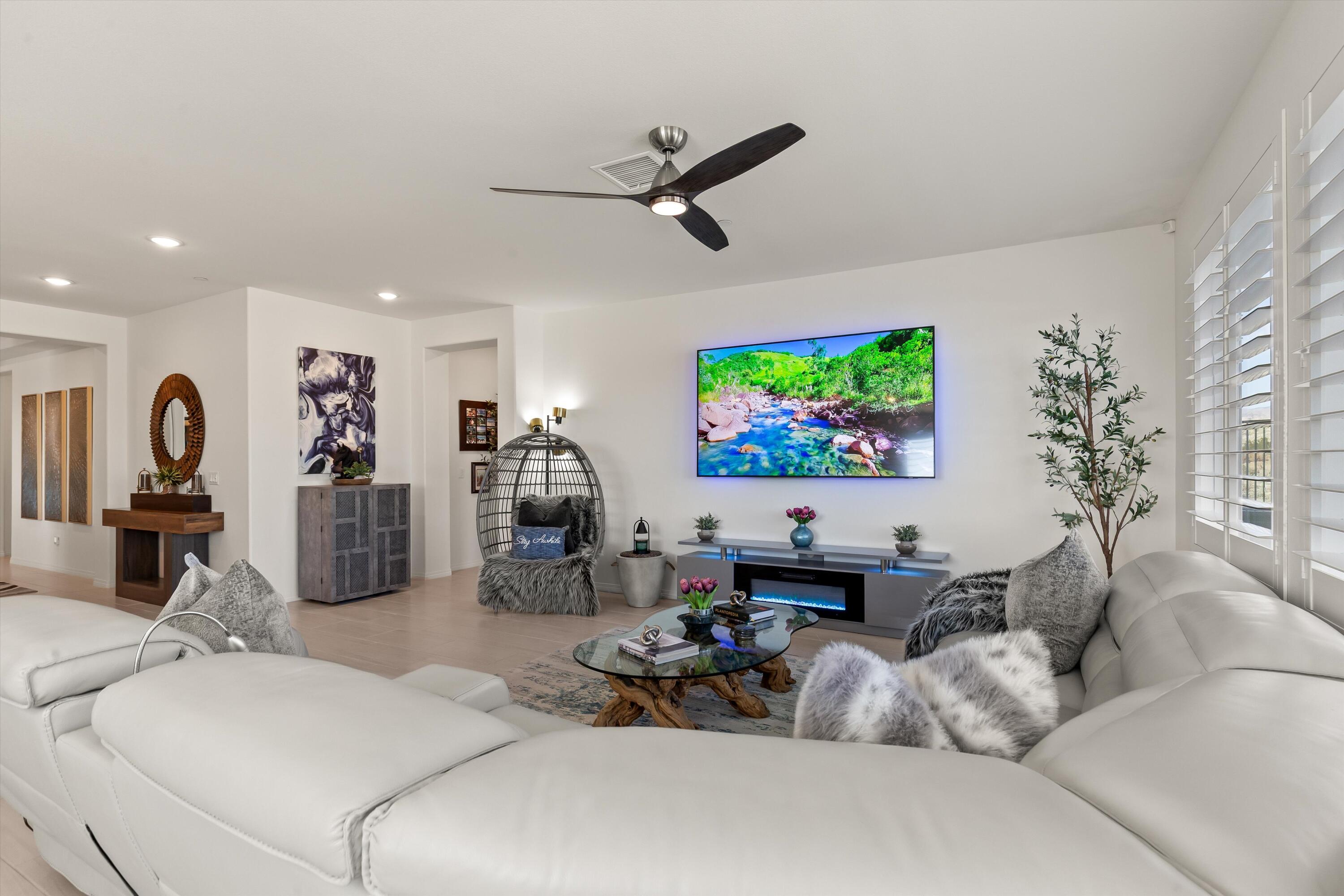 42940 Ascona Lane Indio, CA 92203 - Photo 4 of 36 a living room with furniture and a flat screen tv