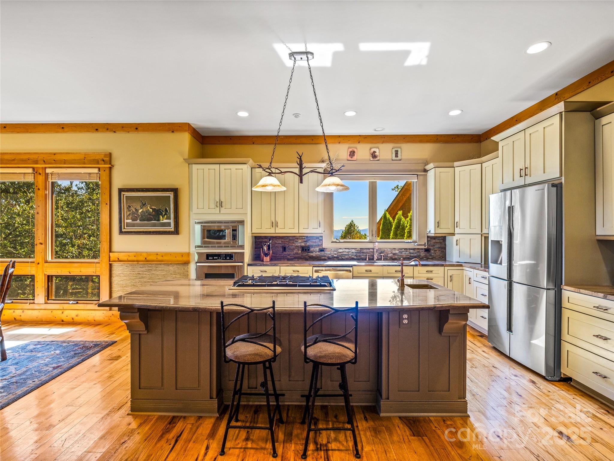 12 Trailridge Road Asheville, NC 28804 - Photo 12 of 45 a kitchen with stainless steel appliances granite countertop a stove and refrigerator