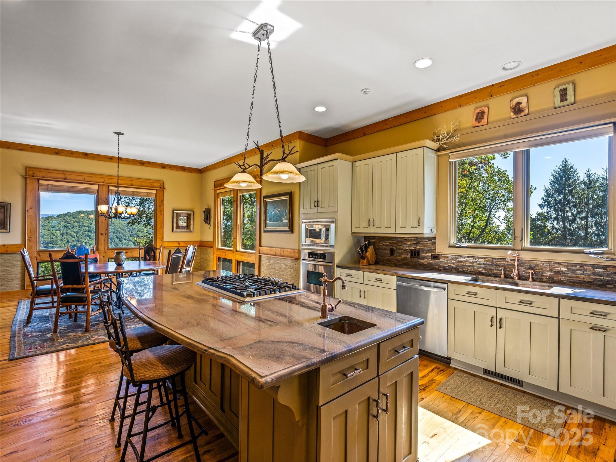 12 Trailridge Road Asheville, NC 28804 - Photo 13 of 45 a kitchen with stainless steel appliances granite countertop a sink and wooden cabinets
