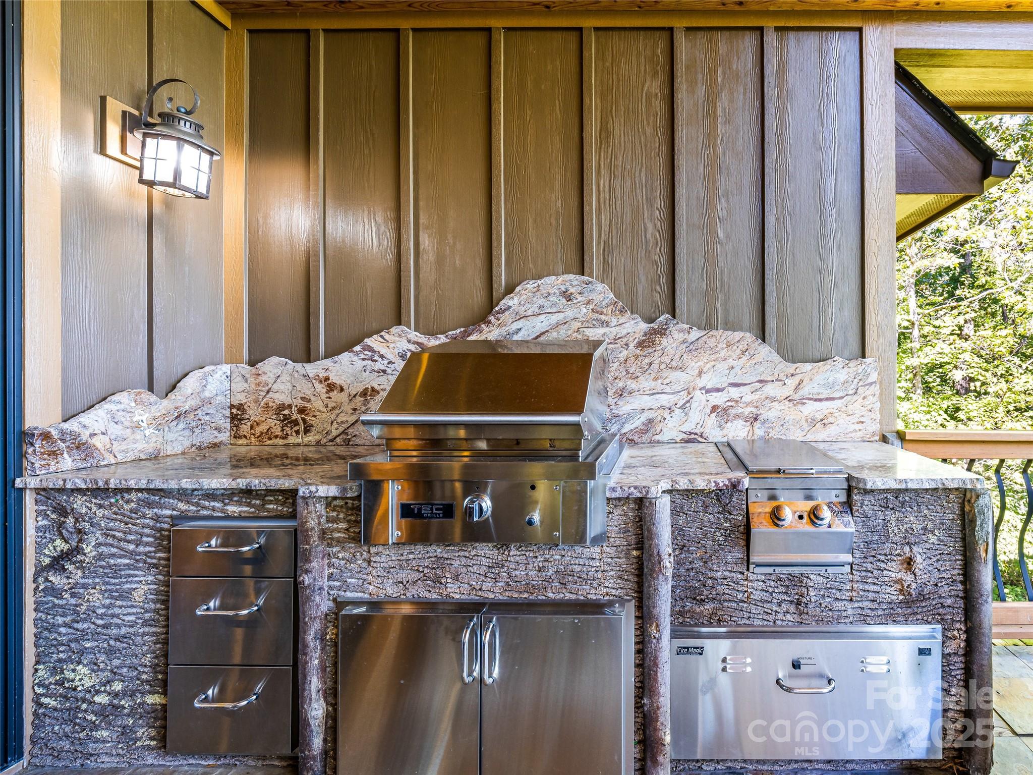 12 Trailridge Road Asheville, NC 28804 - Photo 16 of 45 a kitchen with stainless steel appliances wooden cabinets and a counter top