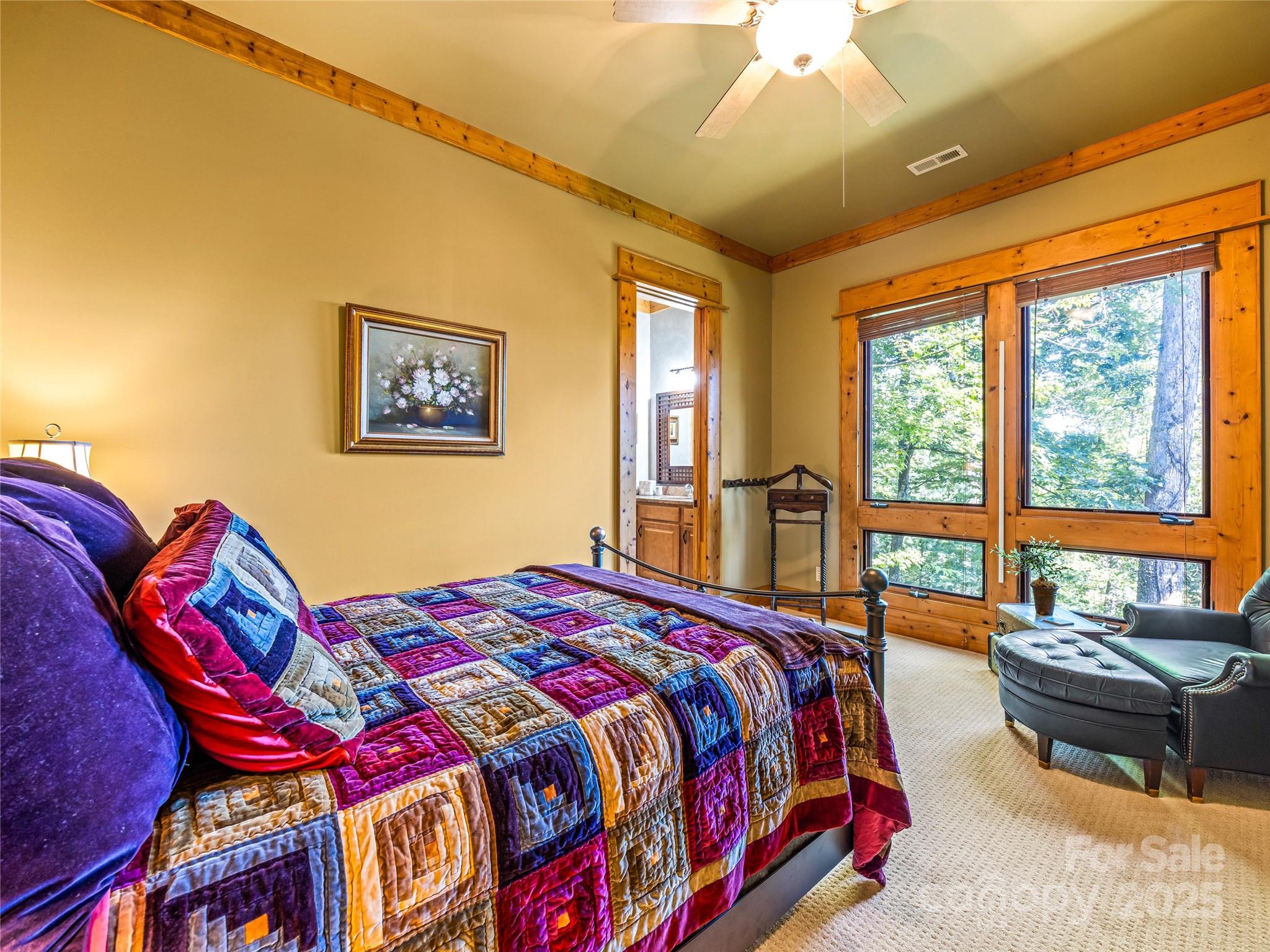 12 Trailridge Road Asheville, NC 28804 - Photo 27 of 45 a bedroom with a bed and wooden floor