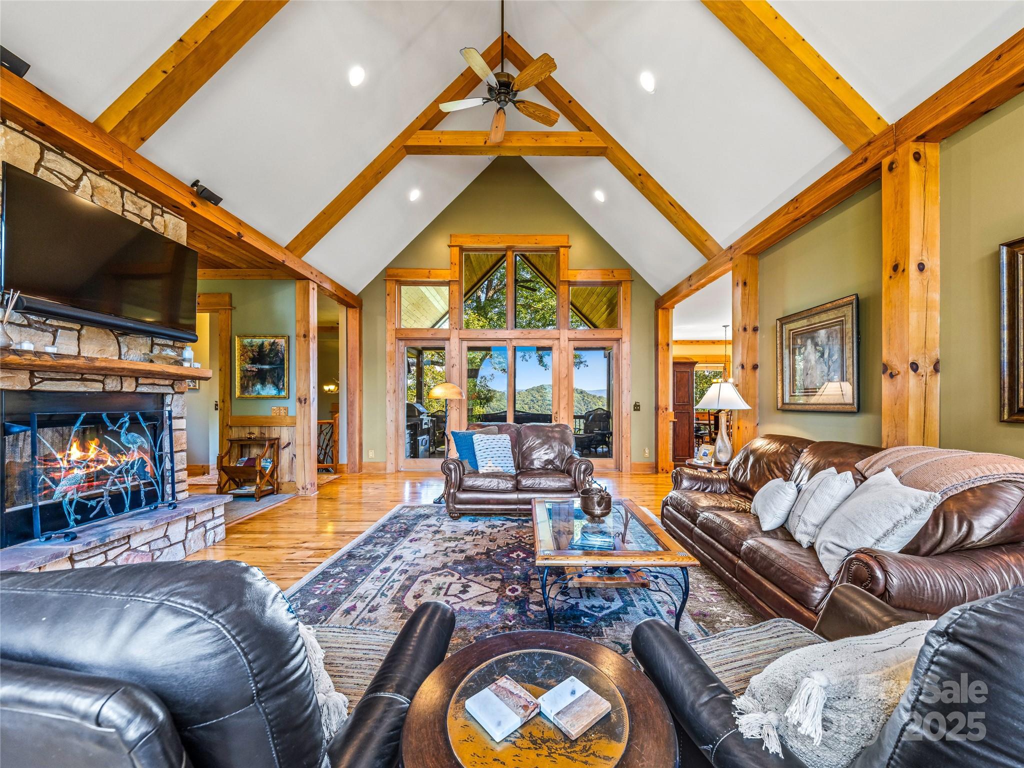 12 Trailridge Road Asheville, NC 28804 - Photo 3 of 45 a living room with furniture a flat screen tv and a fireplace