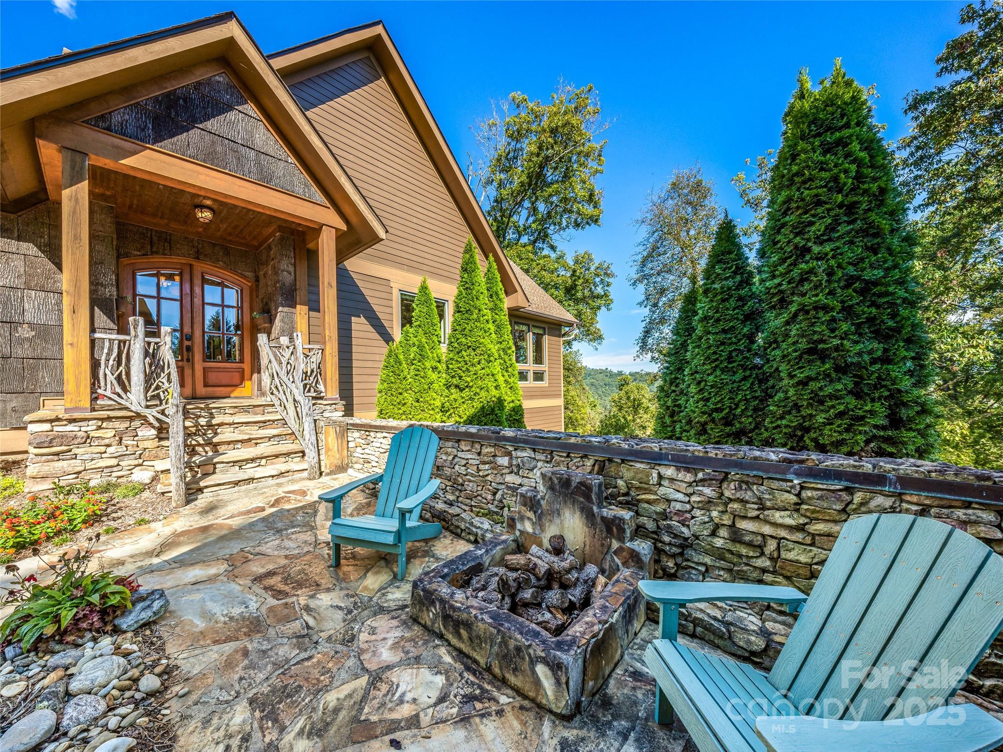 12 Trailridge Road Asheville, NC 28804 - Photo 35 of 45 a view of an outdoor sitting area with wooden fence