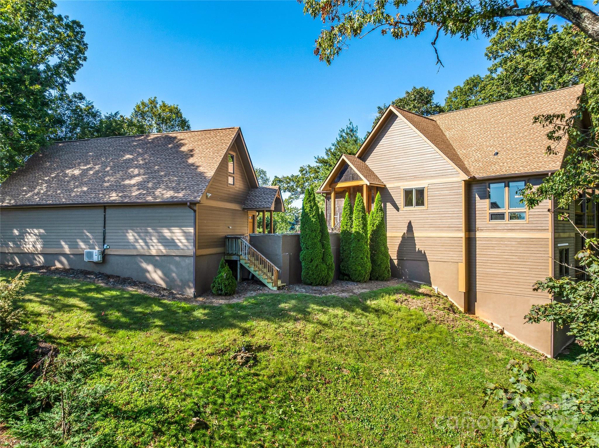 12 Trailridge Road Asheville, NC 28804 - Photo 40 of 45 a view of a house with a yard and plants