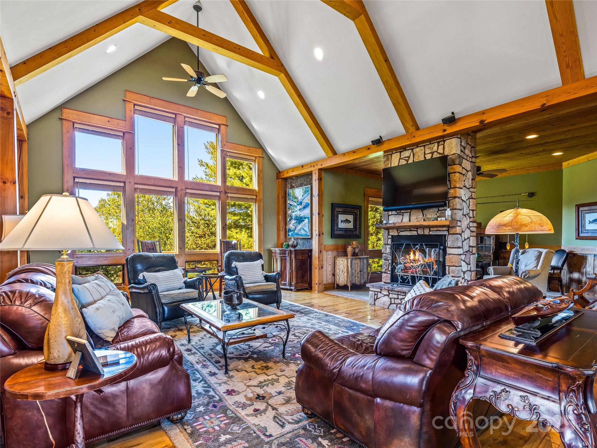 12 Trailridge Road Asheville, NC 28804 - Photo 9 of 45 a living room with furniture a fireplace and a large window