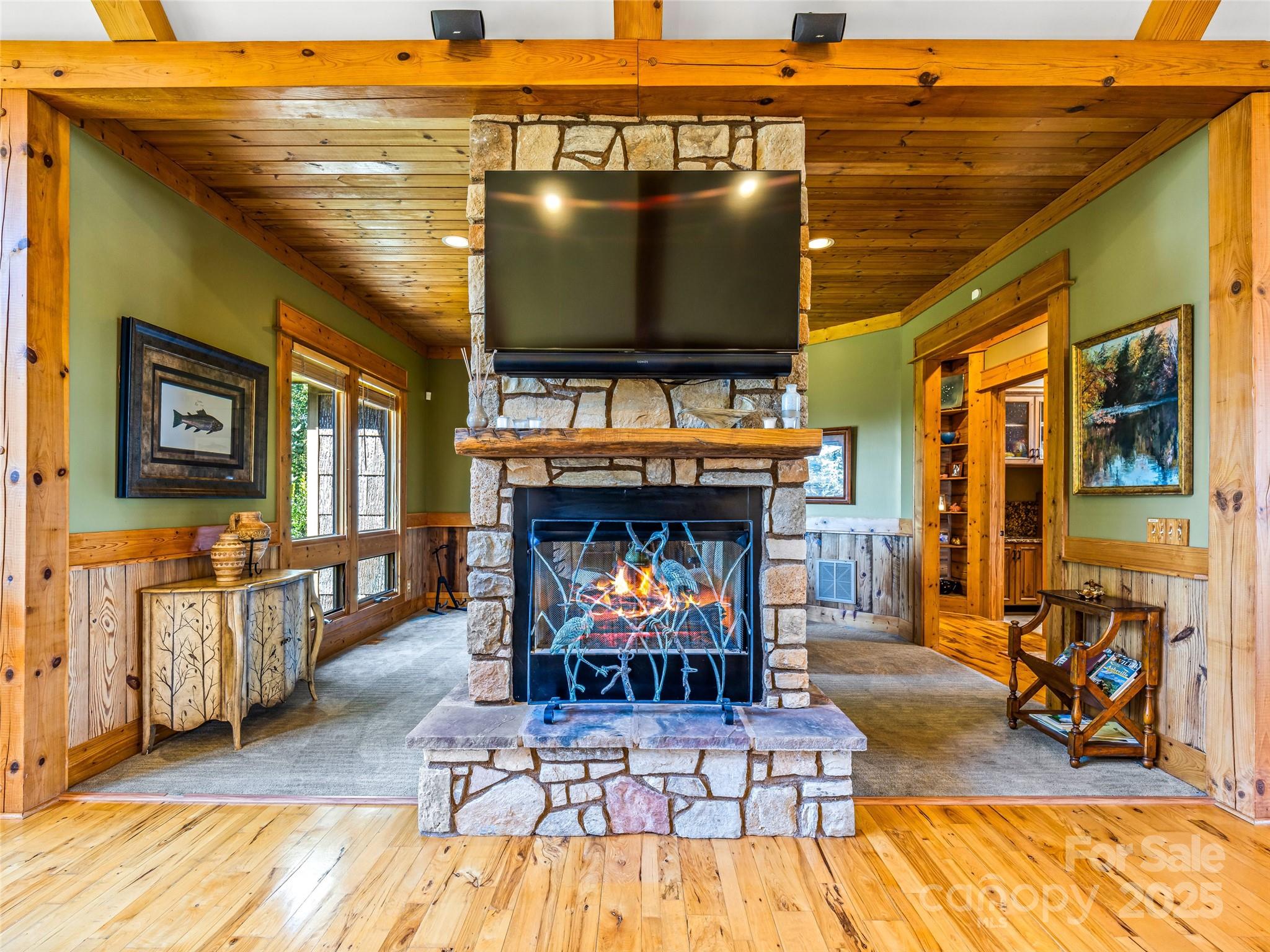 12 Trailridge Road Asheville, NC 28804 - Photo 10 of 45 a living room with furniture a flat screen tv and a fireplace