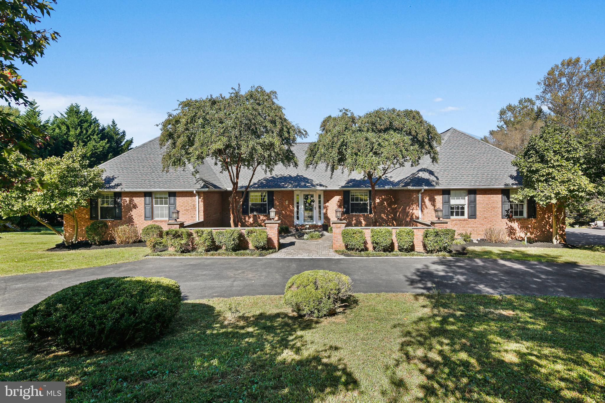 12148 Mt Albert Road Ellicott City, MD 21042 - Photo 1 of 70 a front view of a house with garden and porch