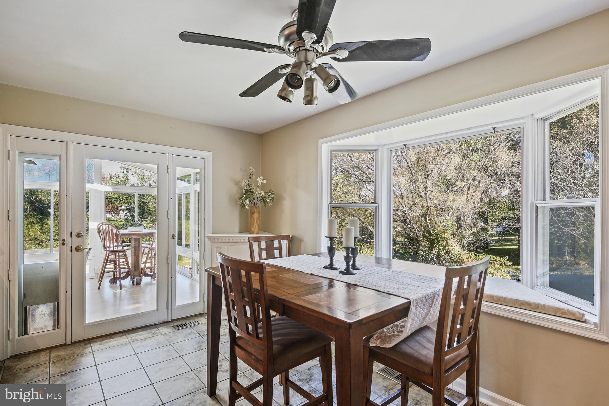 12148 Mt Albert Road Ellicott City, MD 21042 - Photo 14 of 70 a view of a dining room with furniture window and outside view