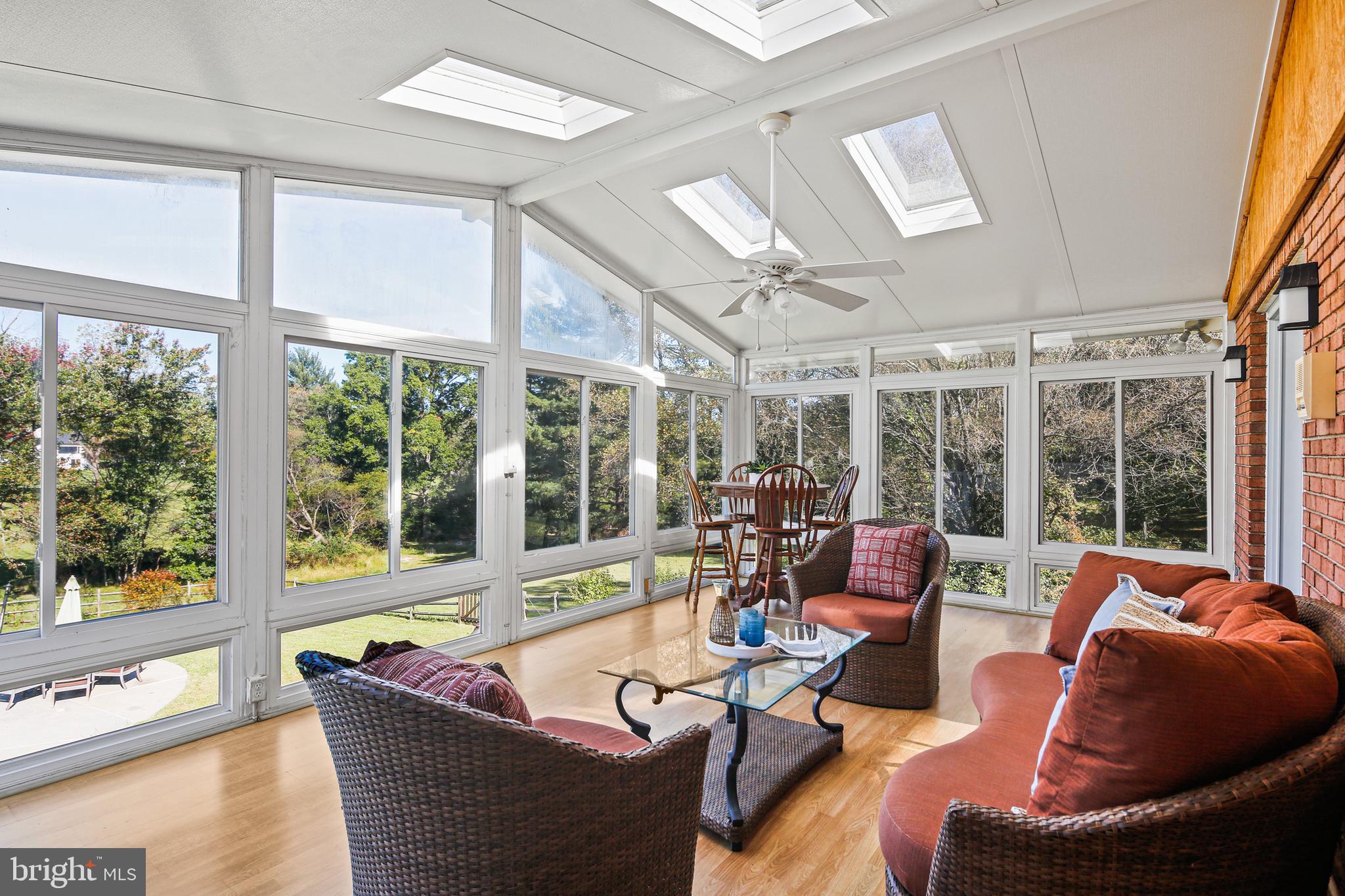 12148 Mt Albert Road Ellicott City, MD 21042 - Photo 15 of 70 a living room with furniture and a large window