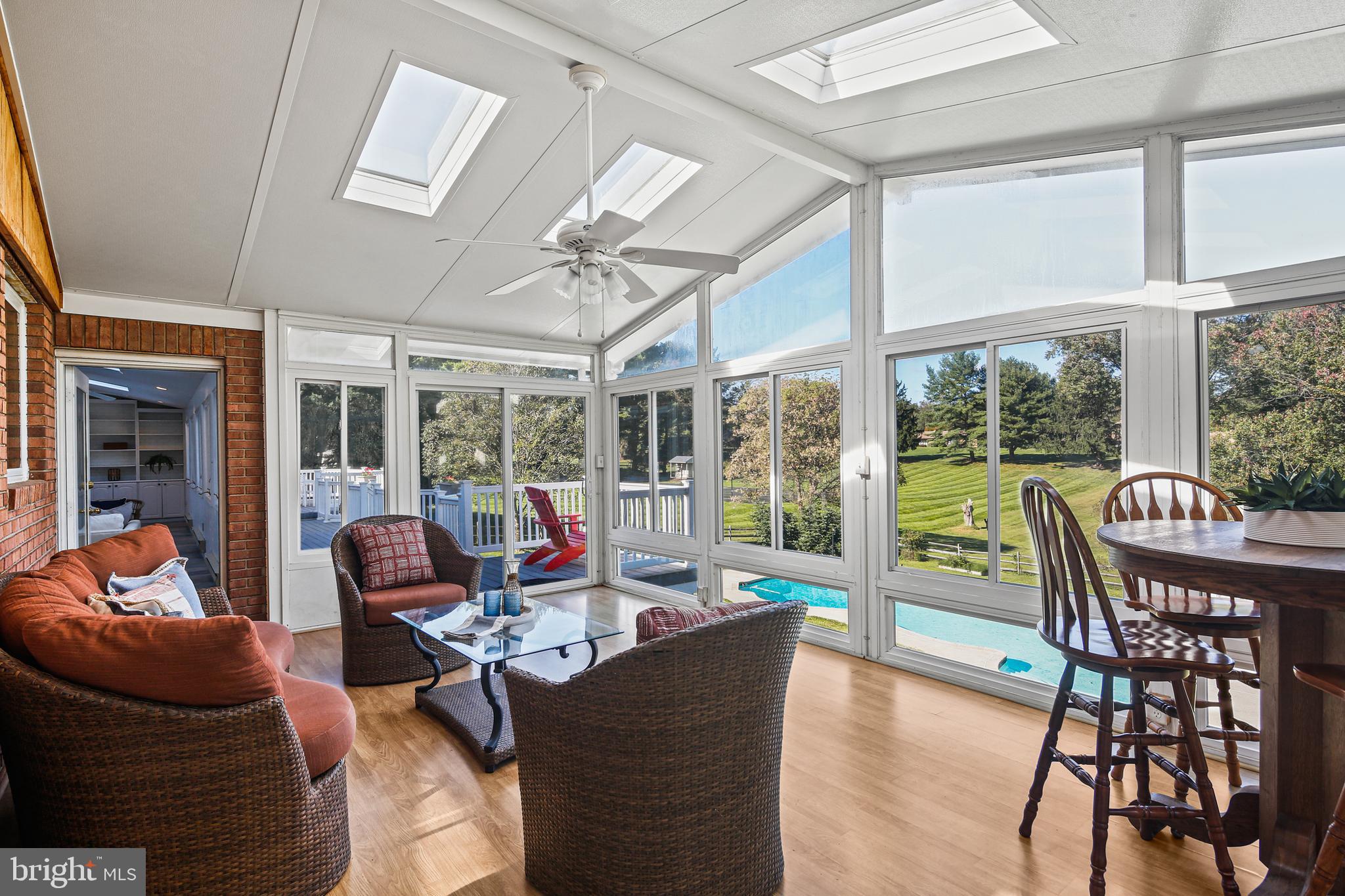 12148 Mt Albert Road Ellicott City, MD 21042 - Photo 16 of 70 a living room with furniture and a large window