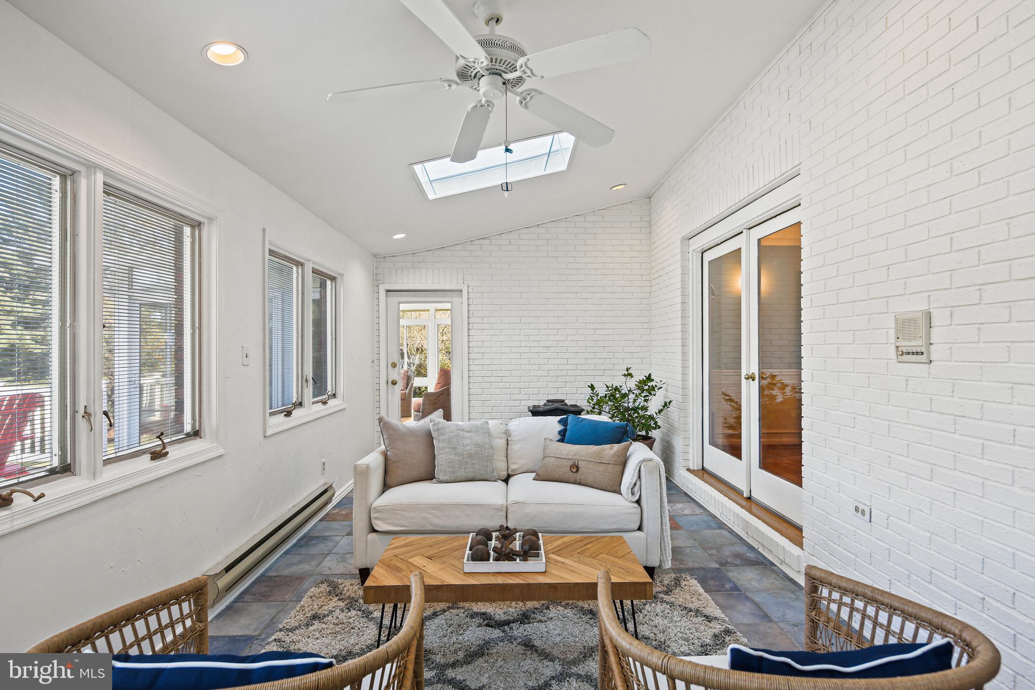 12148 Mt Albert Road Ellicott City, MD 21042 - Photo 17 of 70 a living room with furniture and a window