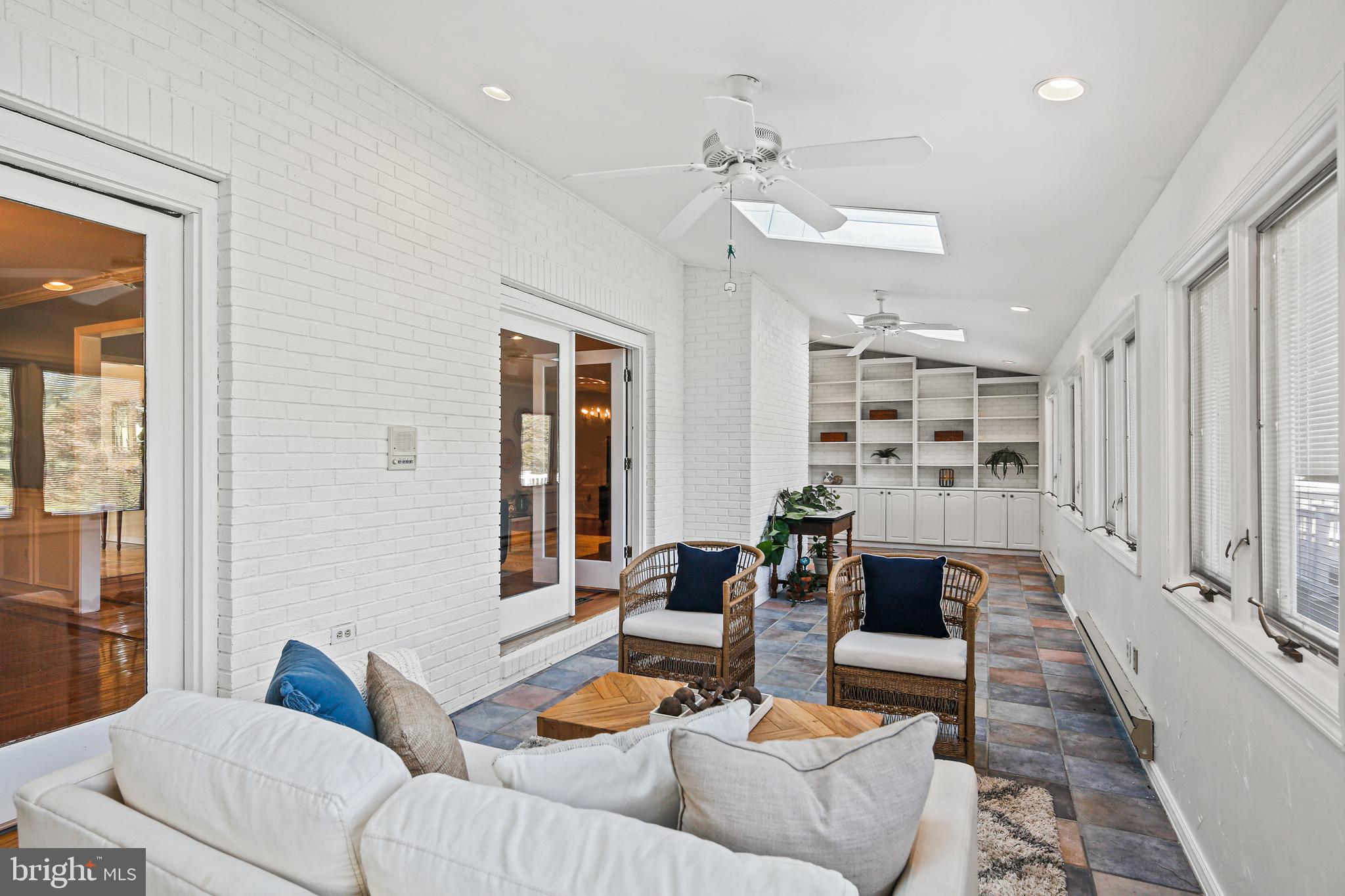 12148 Mt Albert Road Ellicott City, MD 21042 - Photo 18 of 70 a living room with furniture and a large window