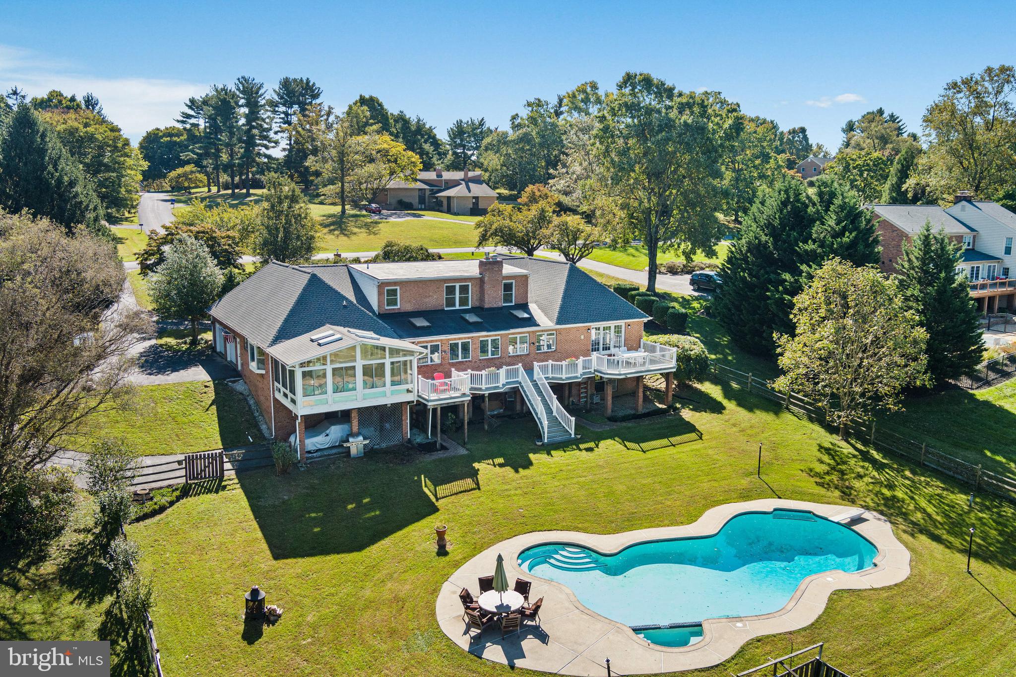 12148 Mt Albert Road Ellicott City, MD 21042 - Photo 2 of 70 an aerial view of a house with swimming pool garden and patio