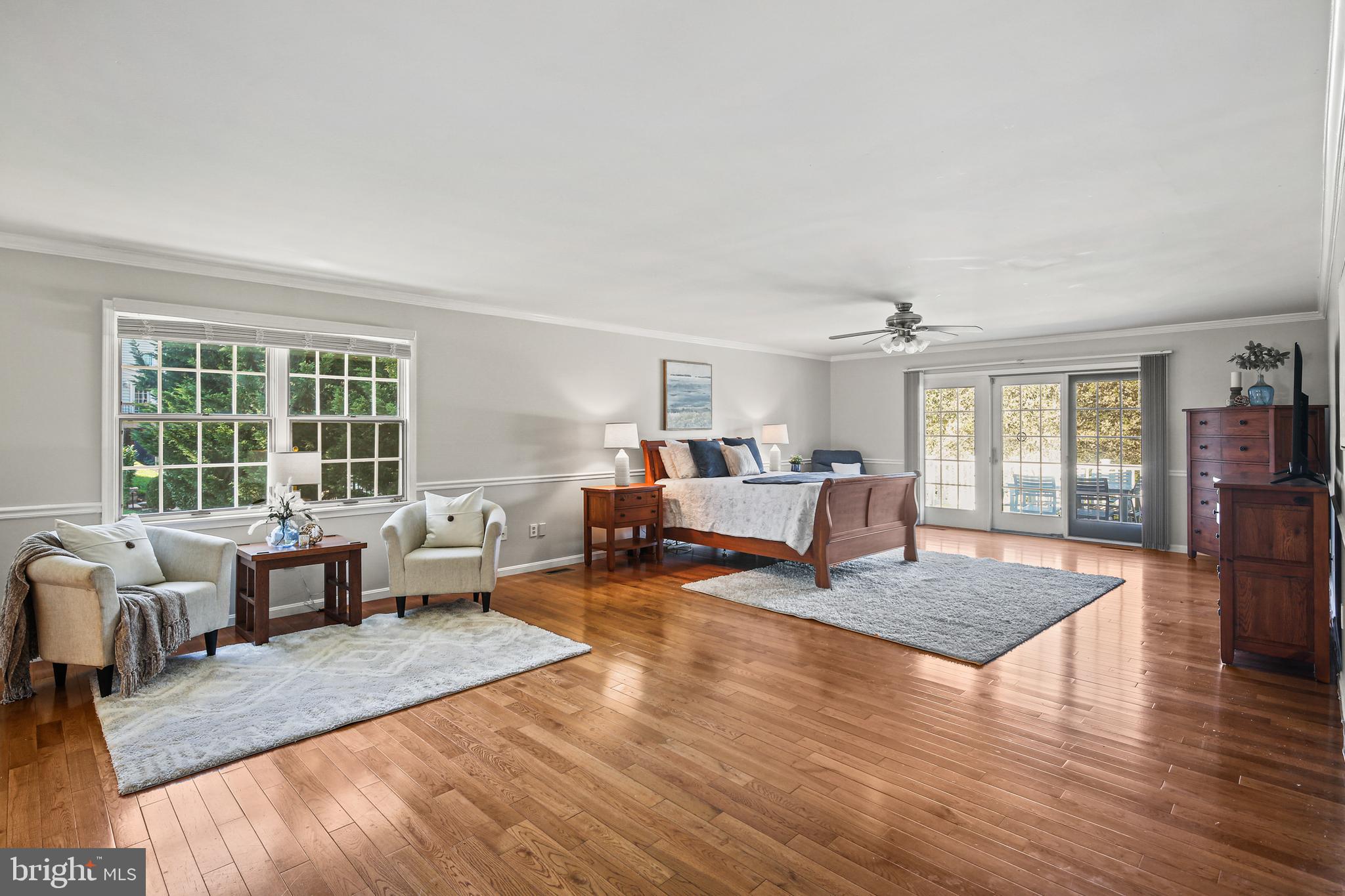 12148 Mt Albert Road Ellicott City, MD 21042 - Photo 22 of 70 a living room with furniture large window and wooden floor
