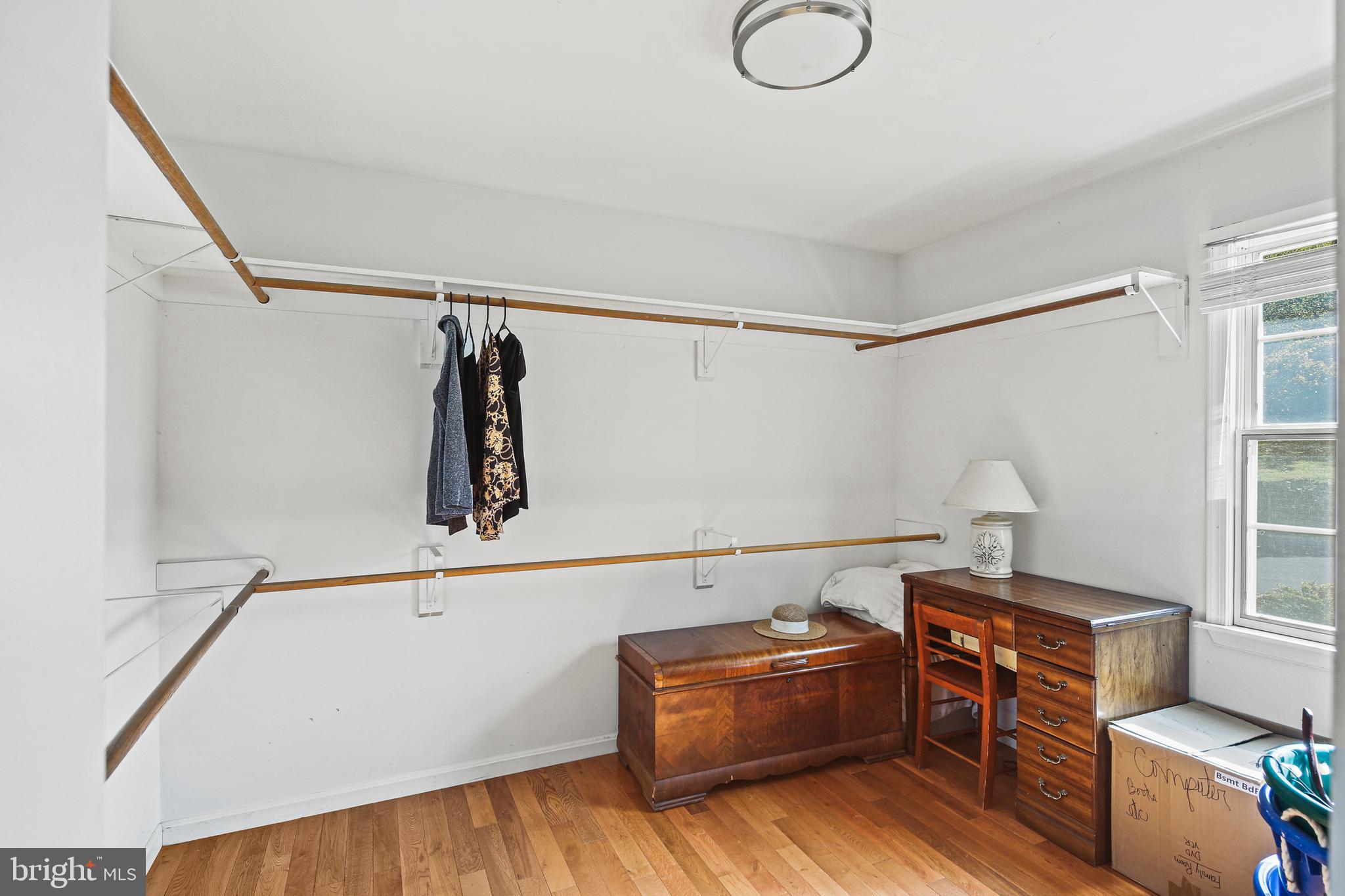 12148 Mt Albert Road Ellicott City, MD 21042 - Photo 29 of 70 a bedroom with a bed and a chandelier