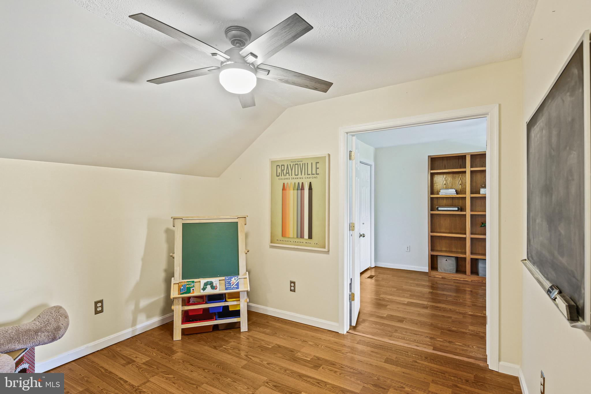 12148 Mt Albert Road Ellicott City, MD 21042 - Photo 32 of 70 a bedroom with a bed and wooden floor