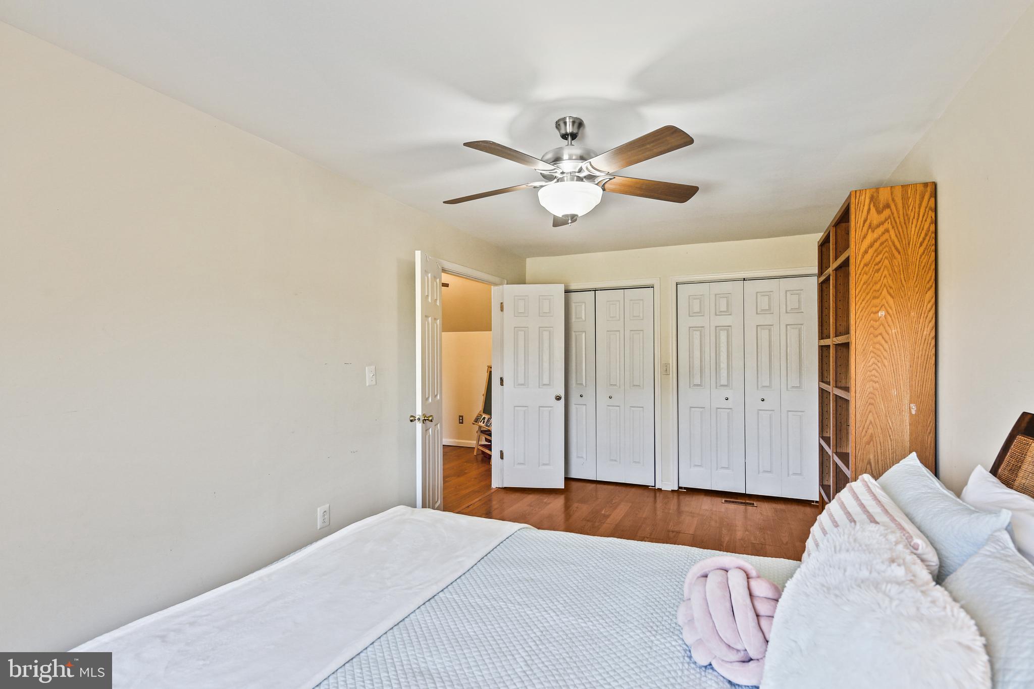 12148 Mt Albert Road Ellicott City, MD 21042 - Photo 34 of 70 a bedroom with a bed and a chandelier