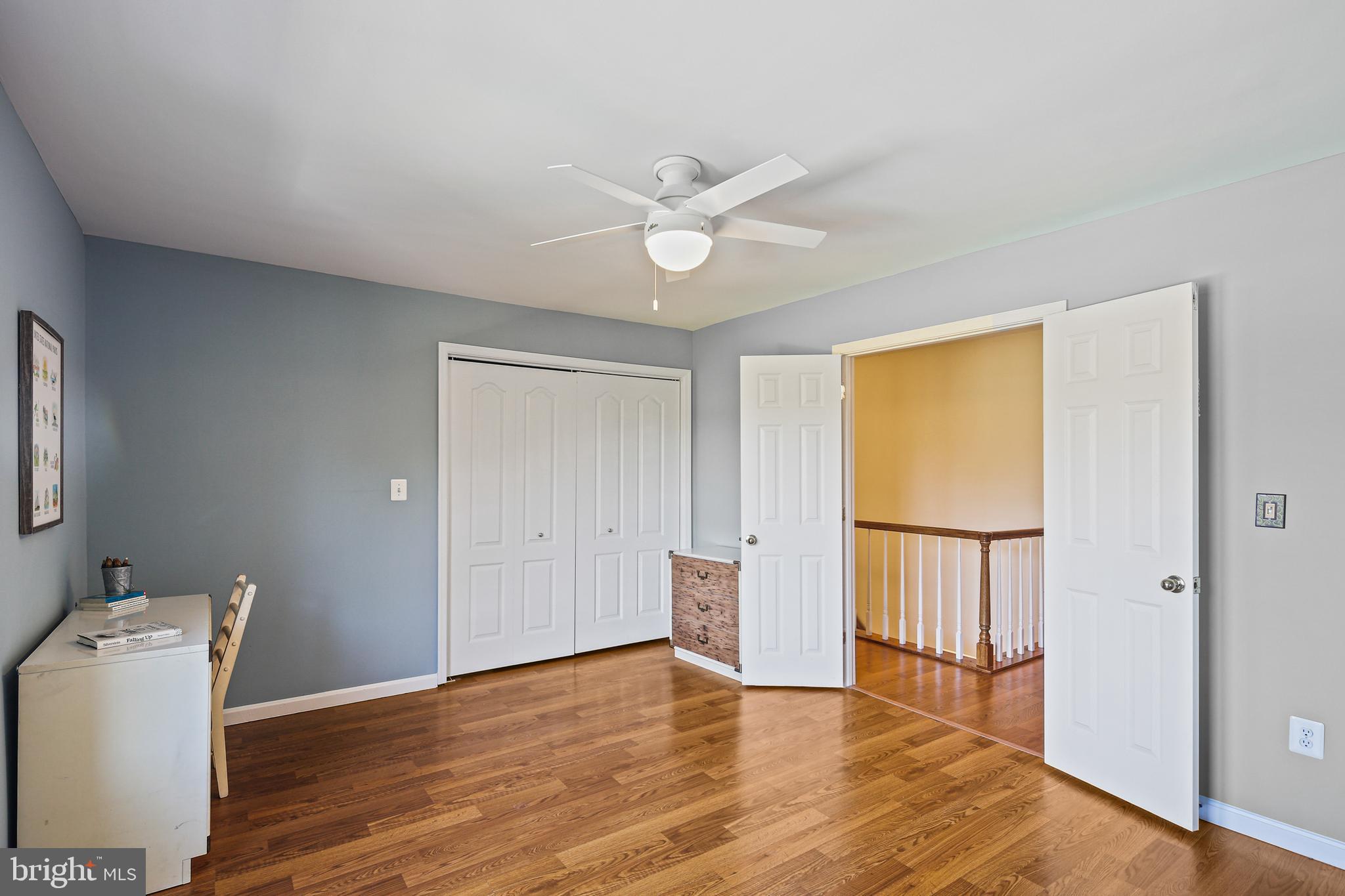 12148 Mt Albert Road Ellicott City, MD 21042 - Photo 36 of 70 a view of an empty room with wooden floor and a window