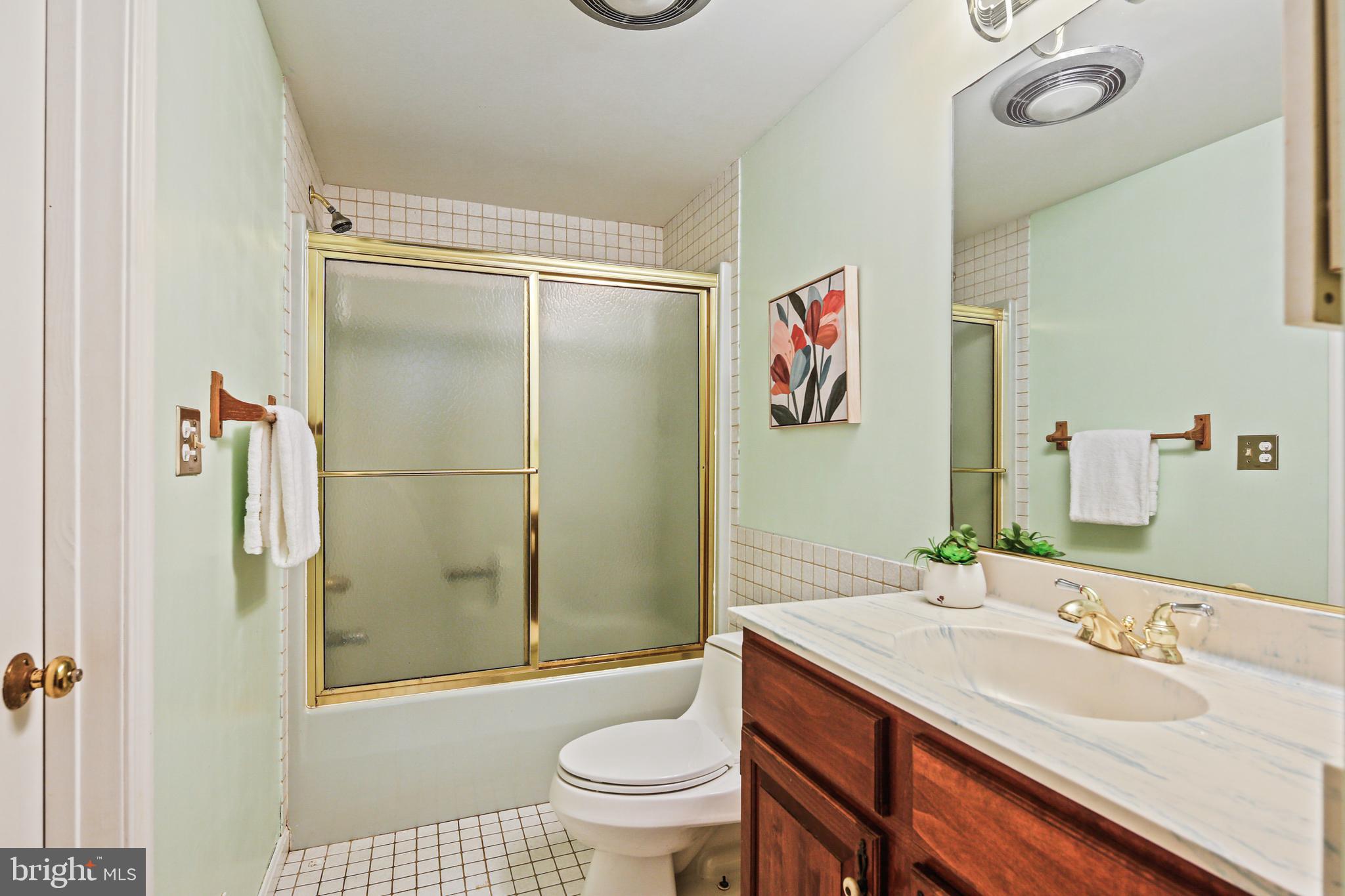 12148 Mt Albert Road Ellicott City, MD 21042 - Photo 46 of 70 a bathroom with a sink toilet and shower