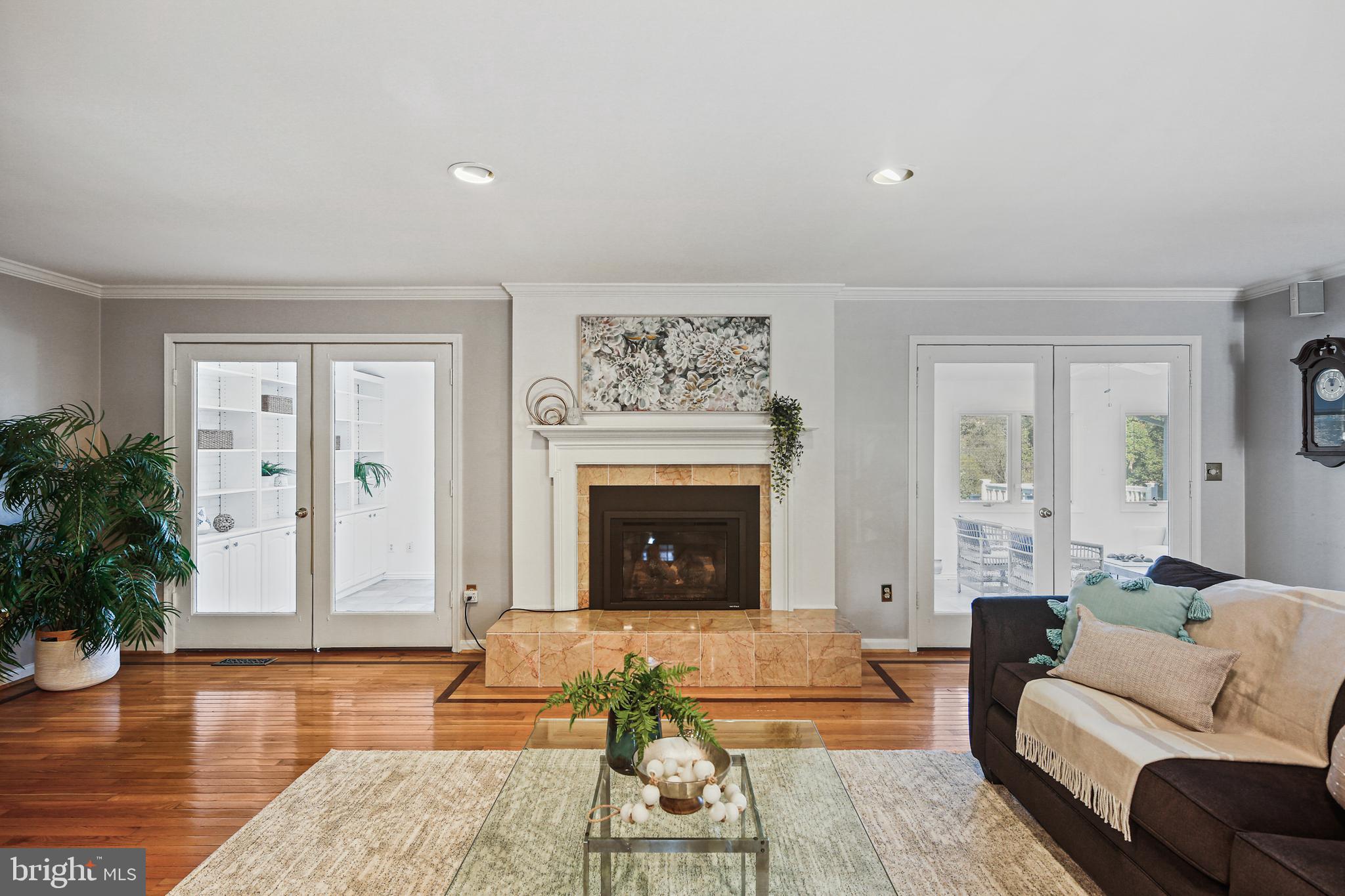12148 Mt Albert Road Ellicott City, MD 21042 - Photo 5 of 70 a living room with furniture and a fireplace