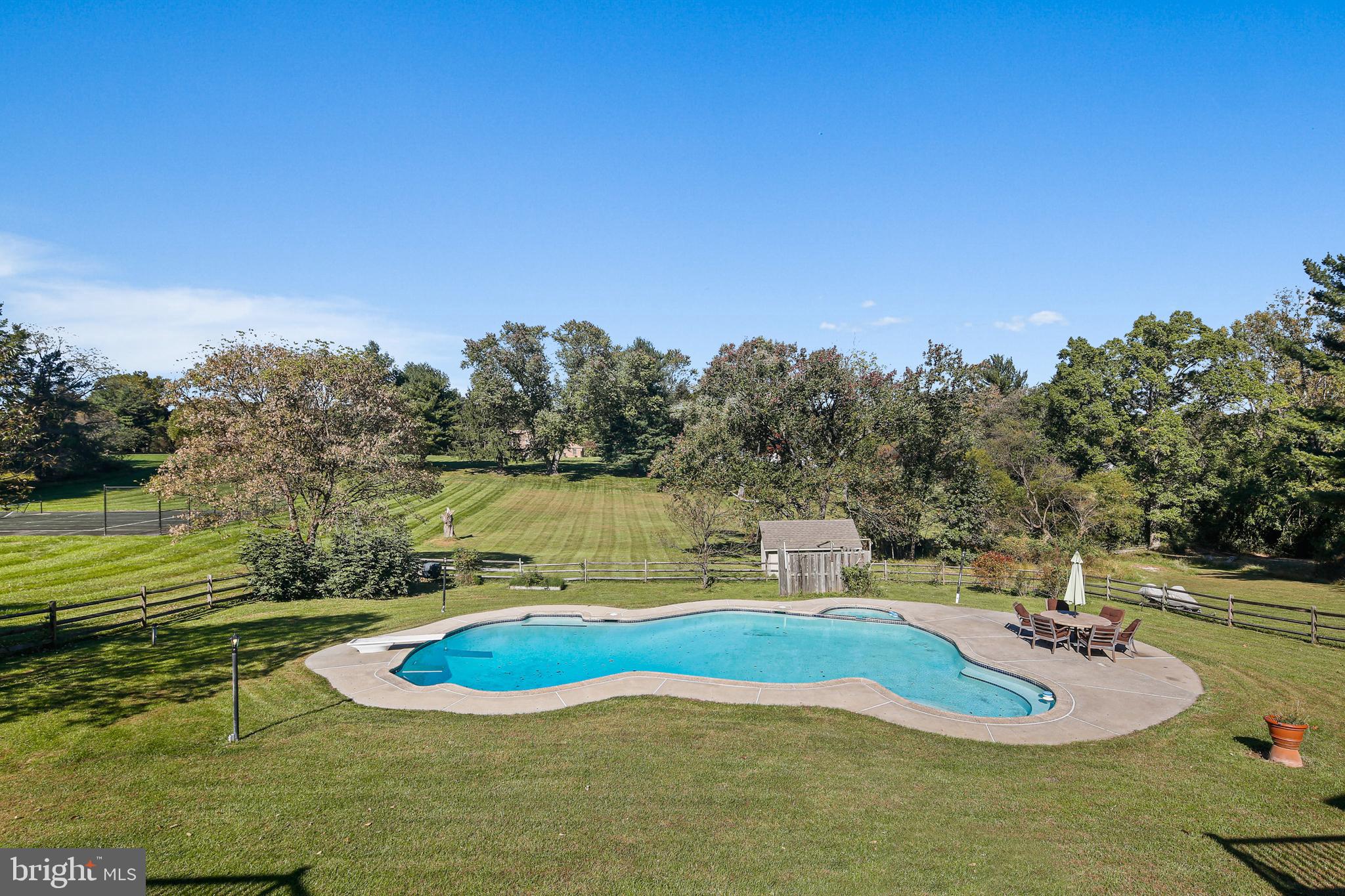 12148 Mt Albert Road Ellicott City, MD 21042 - Photo 52 of 70 a view of a swimming pool with a yard