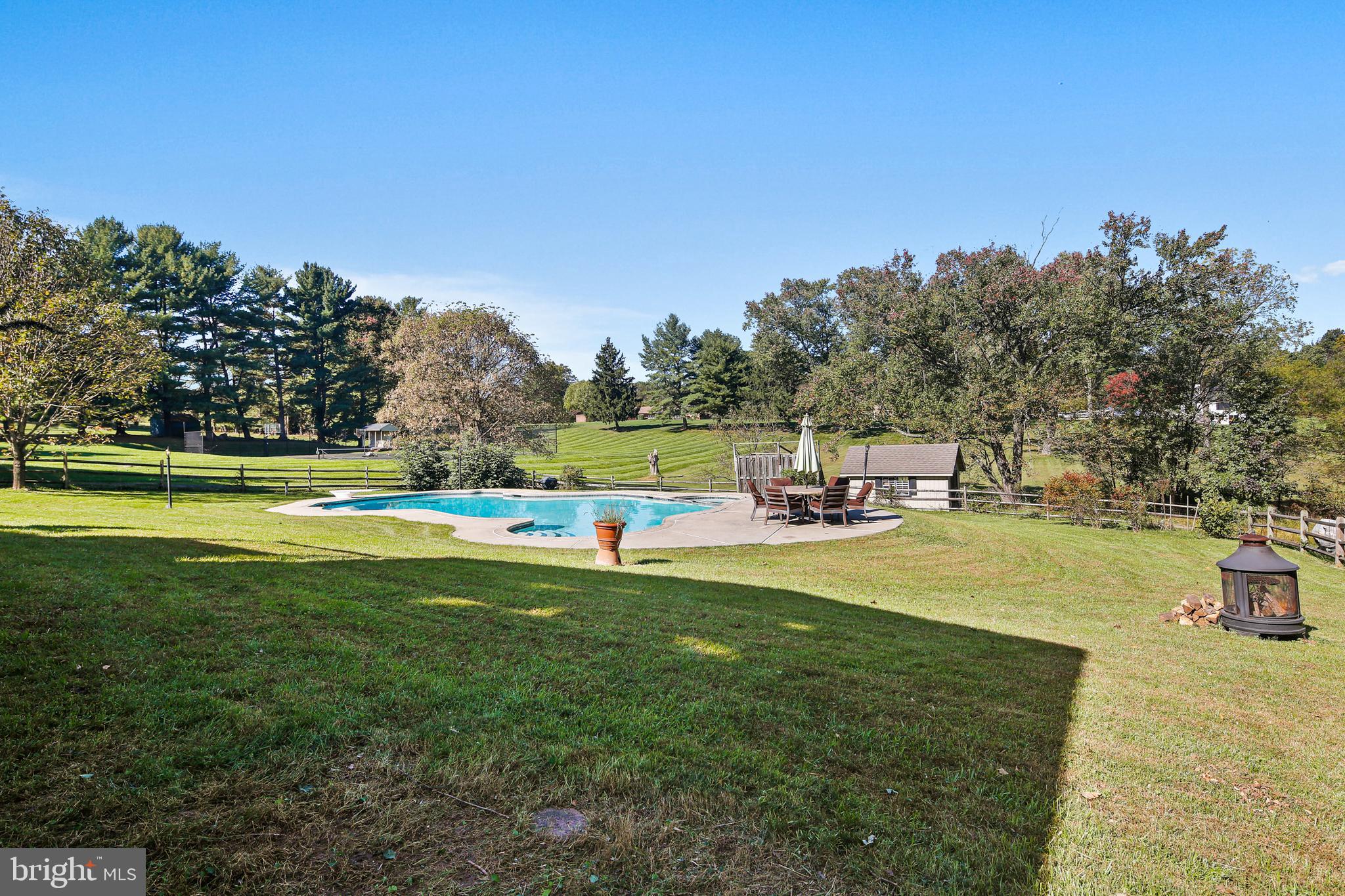 12148 Mt Albert Road Ellicott City, MD 21042 - Photo 53 of 70 a view of a swimming pool with a yard