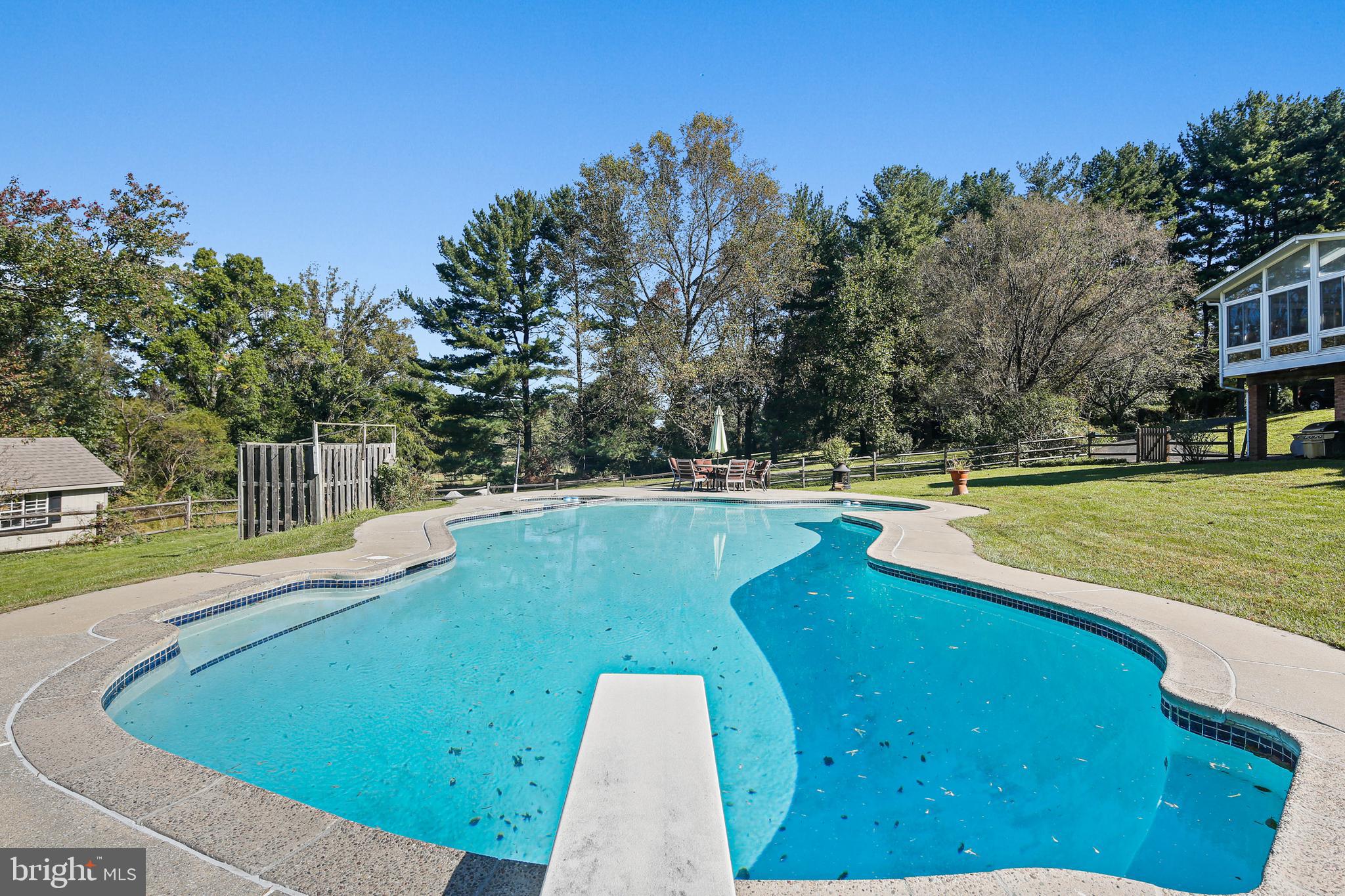 12148 Mt Albert Road Ellicott City, MD 21042 - Photo 54 of 70 a view of a swimming pool with a yard