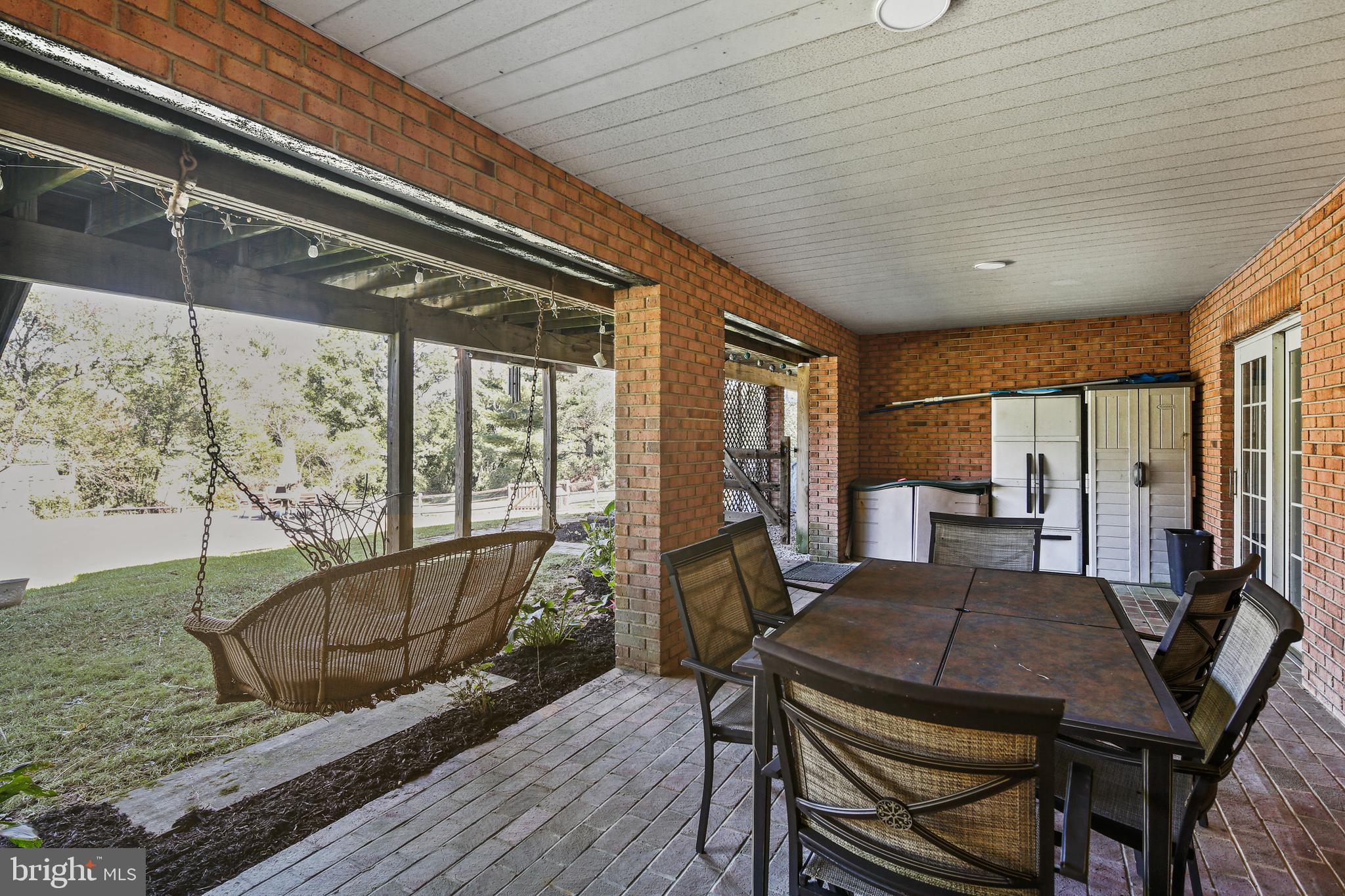 12148 Mt Albert Road Ellicott City, MD 21042 - Photo 55 of 70 a view of a dining room with furniture window and wooden floor
