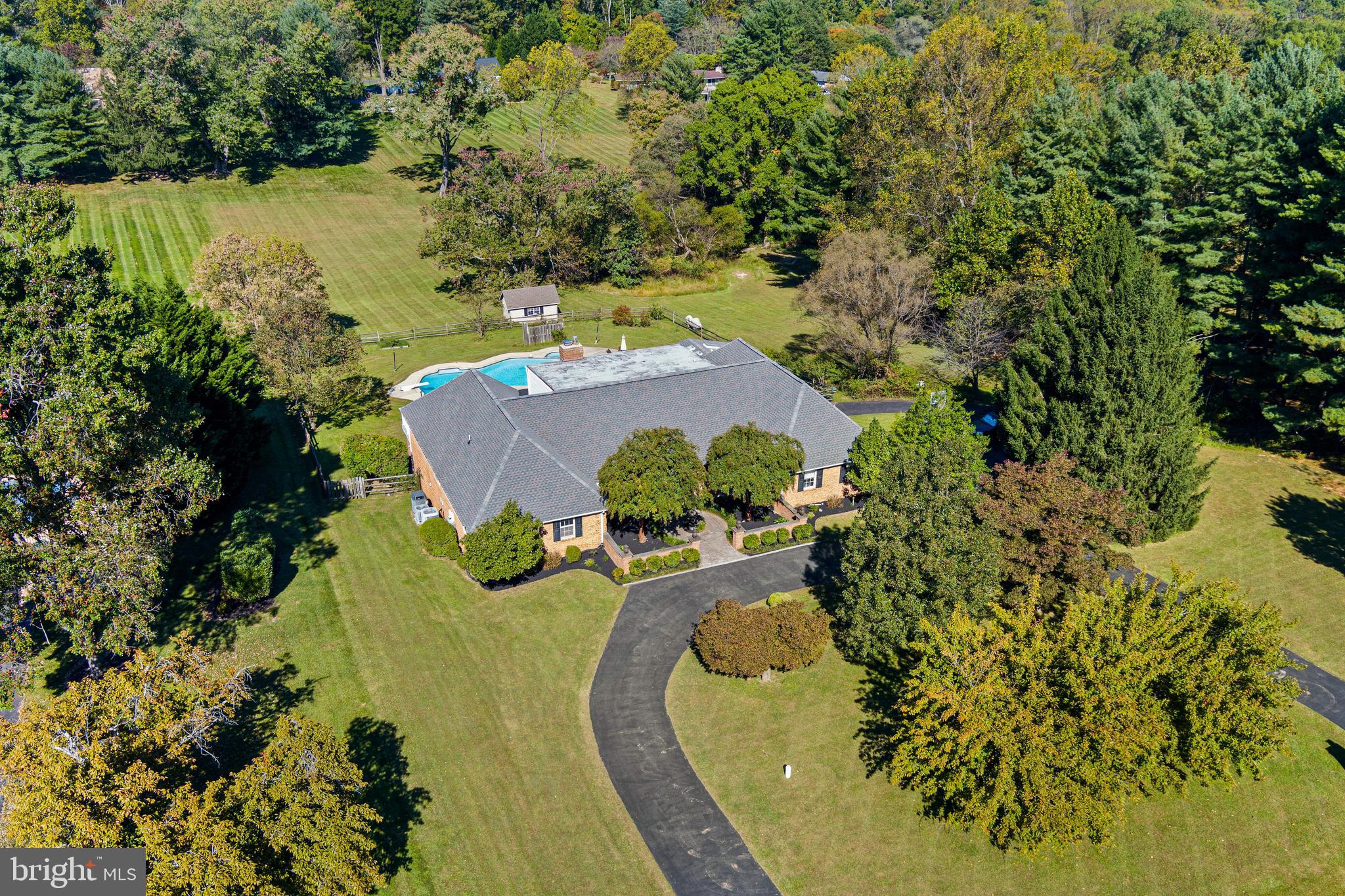 12148 Mt Albert Road Ellicott City, MD 21042 - Photo 60 of 70 an aerial view of a house with yard swimming pool and outdoor seating