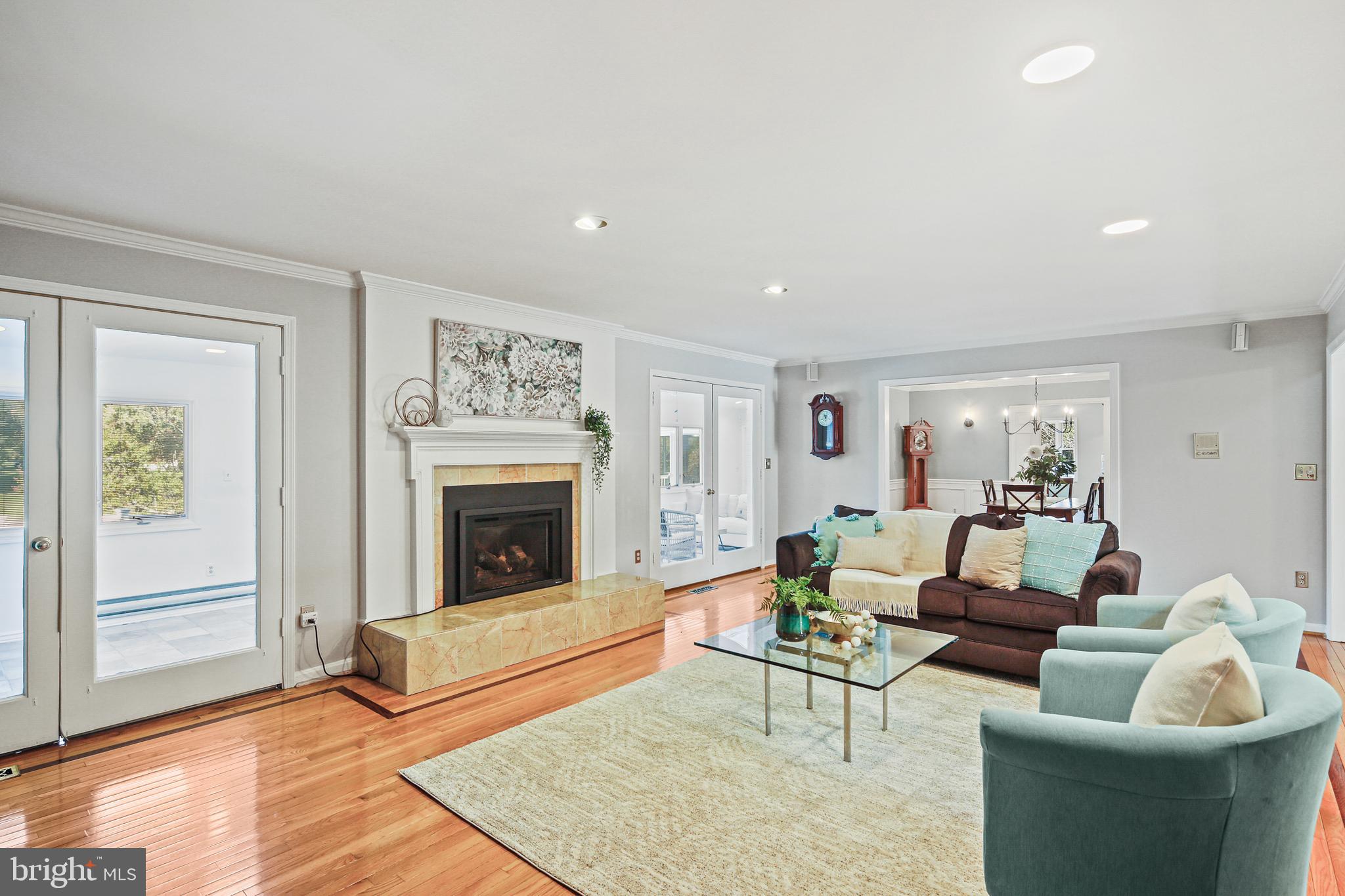 12148 Mt Albert Road Ellicott City, MD 21042 - Photo 6 of 70 a living room with furniture and a fireplace