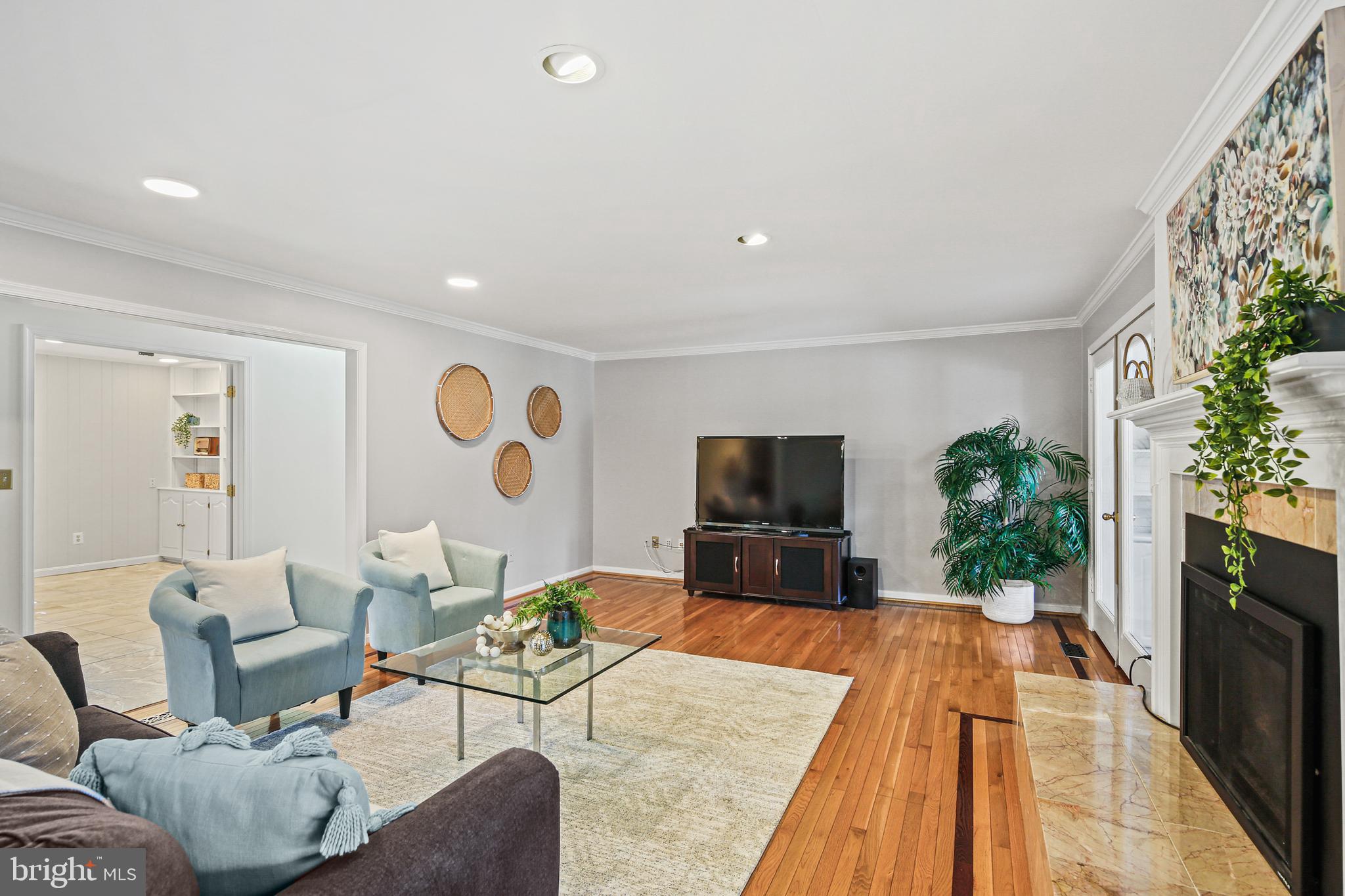 12148 Mt Albert Road Ellicott City, MD 21042 - Photo 7 of 70 a living room with furniture and a flat screen tv