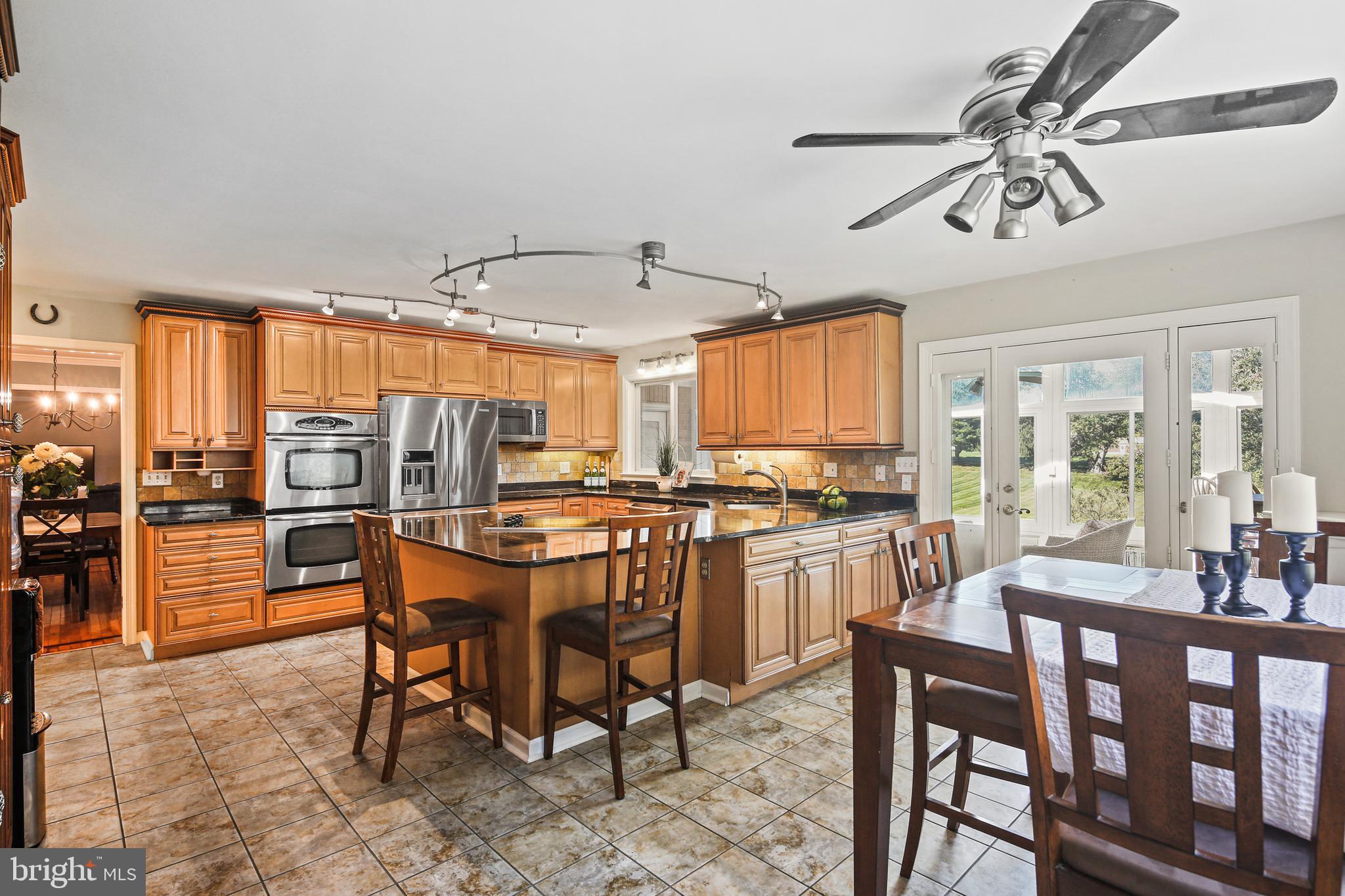 12148 Mt Albert Road Ellicott City, MD 21042 - Photo 10 of 70 a view of a dining room with furniture window and outside view