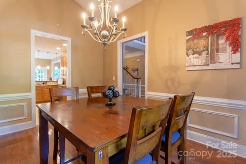 207 Streamside Place Mooresville, NC 28115 - Photo 16 of 42 a view of a dining room with furniture and chandelier