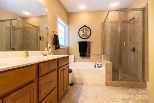 207 Streamside Place Mooresville, NC 28115 - Photo 19 of 42 a bathroom with a sink a mirror and a shower