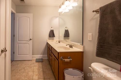 207 Streamside Place Mooresville, NC 28115 - Photo 26 of 42 a bathroom with a sink a toilet and shower