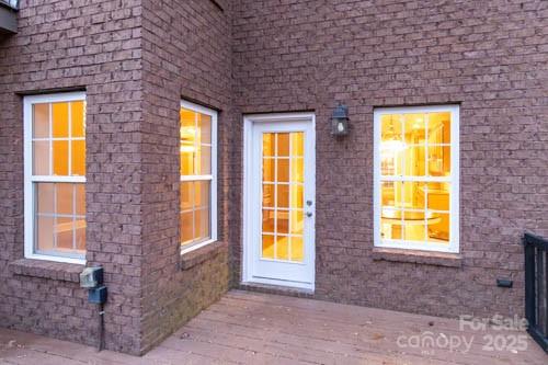 207 Streamside Place Mooresville, NC 28115 - Photo 36 of 42 a view of a brick house with a large windows