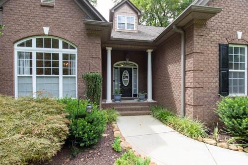 207 Streamside Place Mooresville, NC 28115 - Photo 4 of 42 a front view of a house with a yard