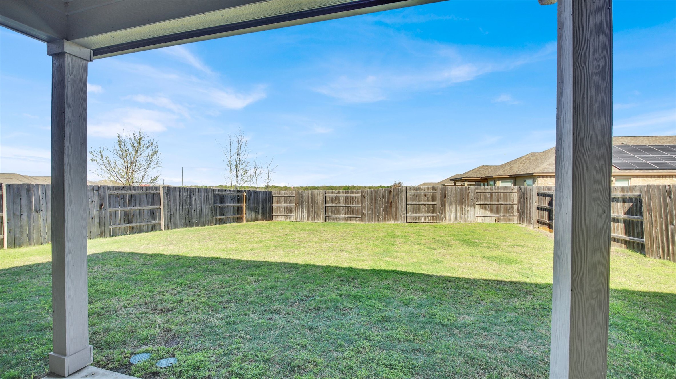 13716 Sugar Bush Path Manor, TX 78653 - Photo 5 of 37 Fenced backyard featuring a patio