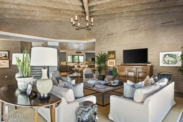 a view of backyard of house with outdoor seating and green space