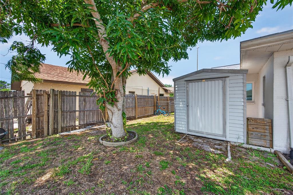 532 Center Road Venice, FL 34285 - Photo 56 of 68 a house with trees in front of it