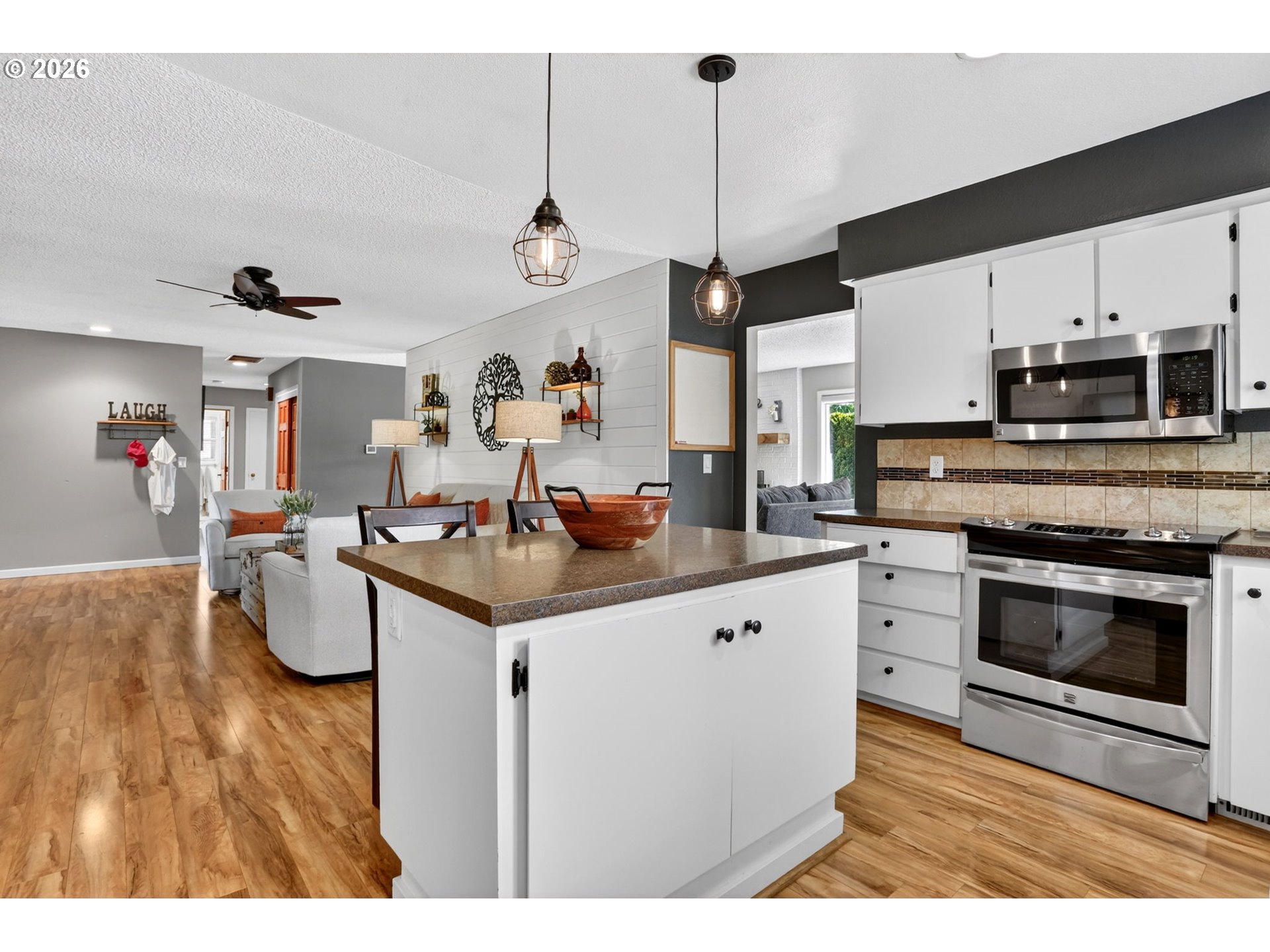 1776 Southeast 114th Place Portland, OR 97216 - Photo 18 of 47 a kitchen with kitchen island a counter space a sink appliances and cabinets