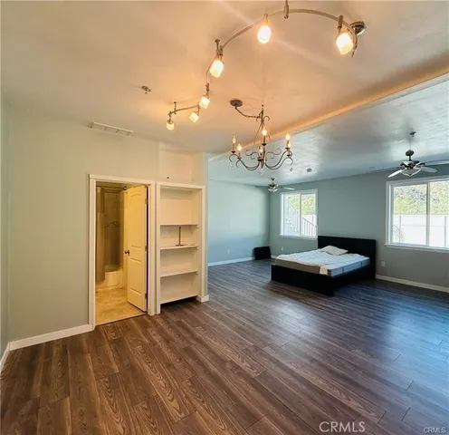 a view of a livingroom with furniture and wooden floor