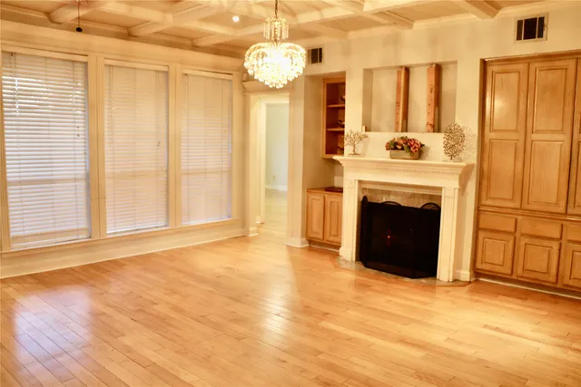 a view of a livingroom with a fireplace and window