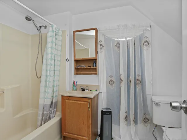 a bedroom with a bed and cabinets