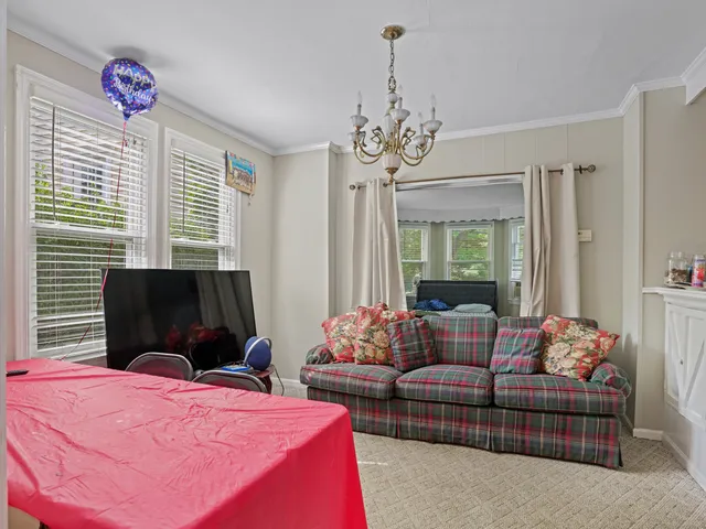 a bedroom with furniture and windows