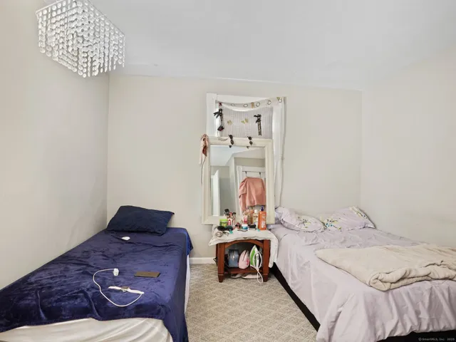 a bed room with a bed and a window