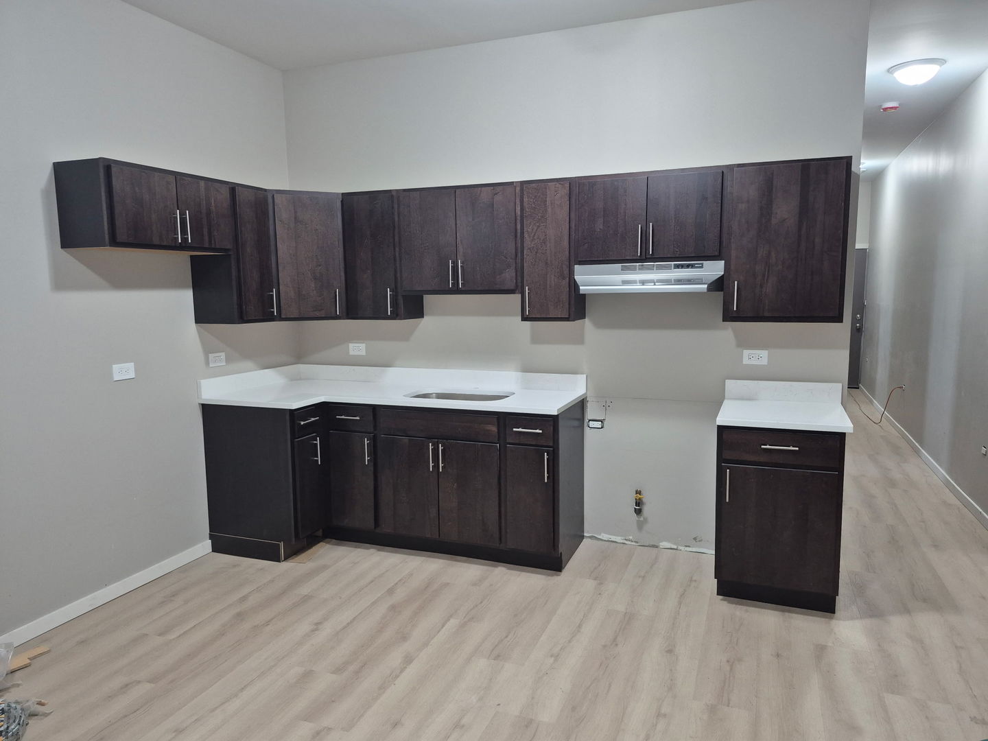 22 North Pulaski Road, Unit 1R Chicago, IL 60624 - Photo 7 of 17 a kitchen with a refrigerator and a sink