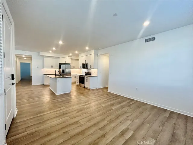 a view of kitchen with wooden floor
